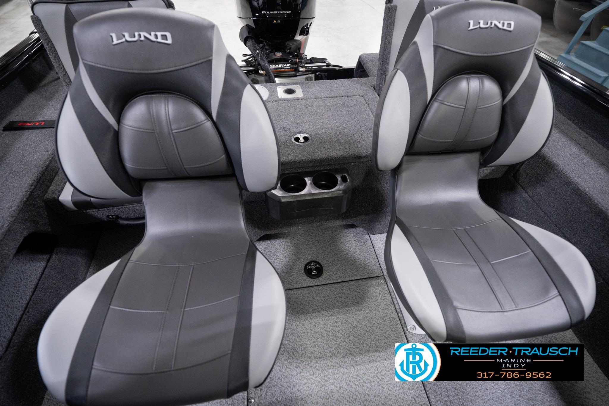 2026 Lund 1775 Impact XS SS boat interior with gray seats and cup holders.