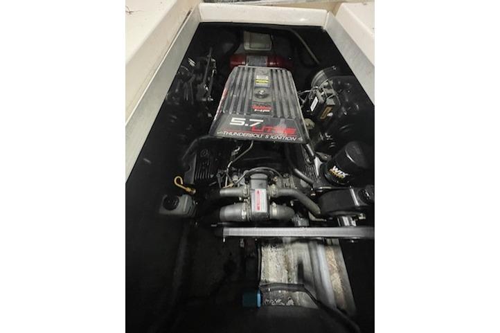 Engine compartment of a 1998 Searay 270 Sundancer boat, featuring a 5.7L engine.