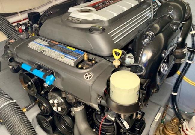 Engine of a 2016 Carver C37 boat, showcasing detailed components and design.