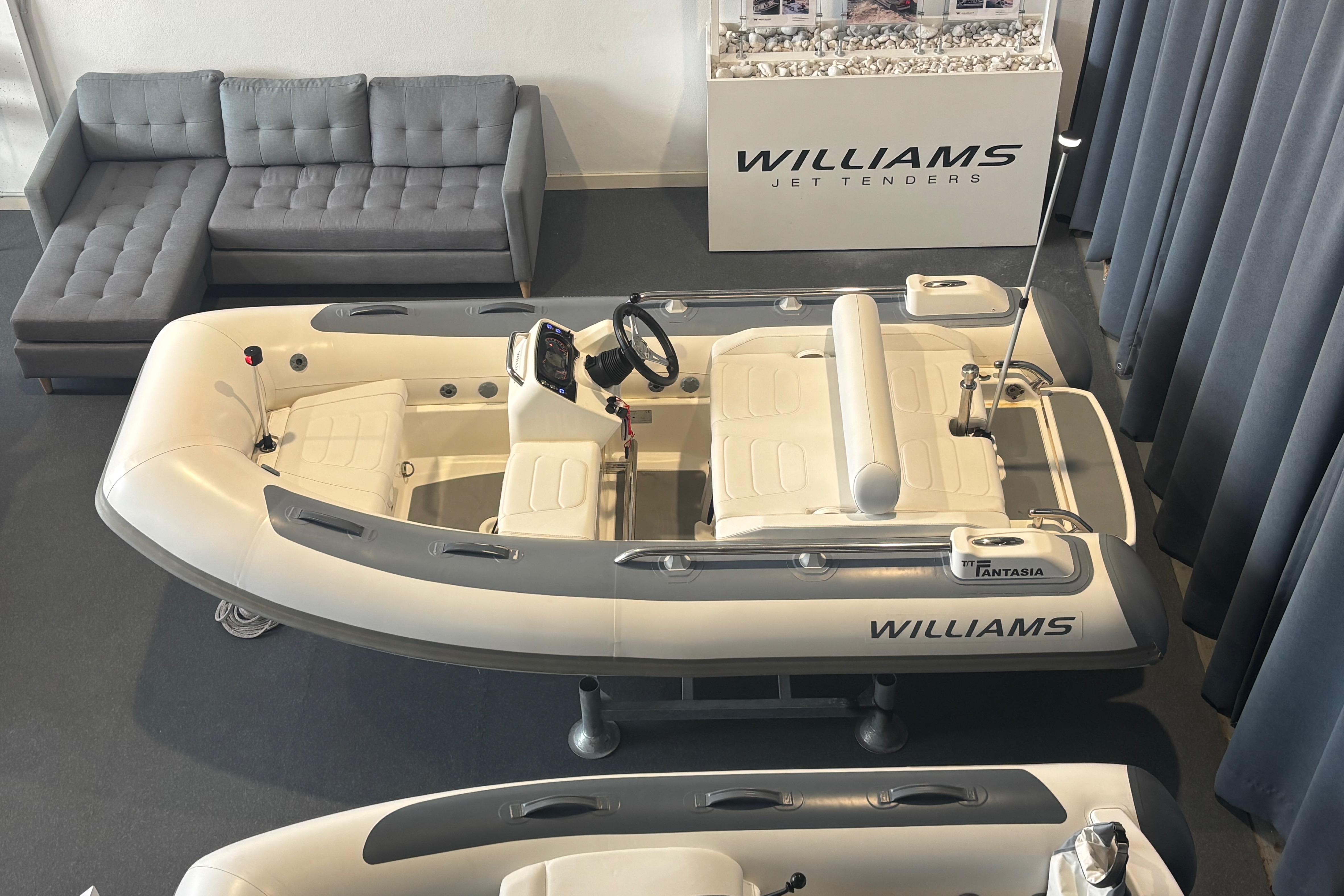 2018 Williams Jet Tenders Sportjet 345 displayed indoors with seating and controls.