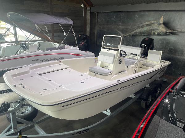 2024 Mako Pro Skiff 19 CC boat on display in showroom.