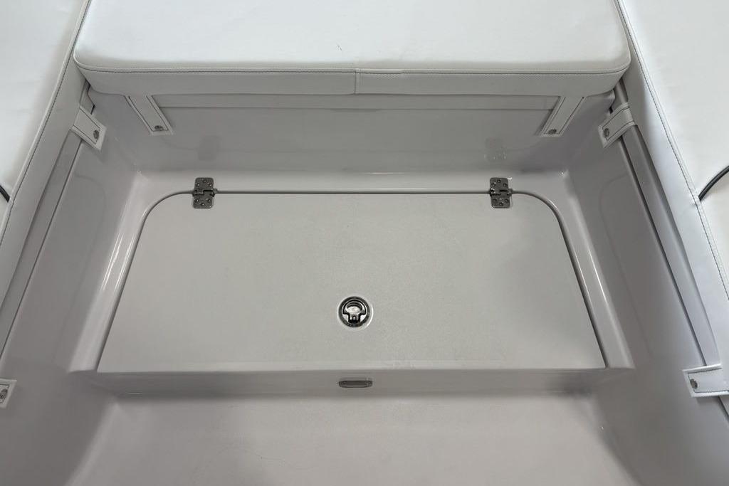2026 Sportsman Masters 247 Bay Boat storage compartment with cushioned seating.