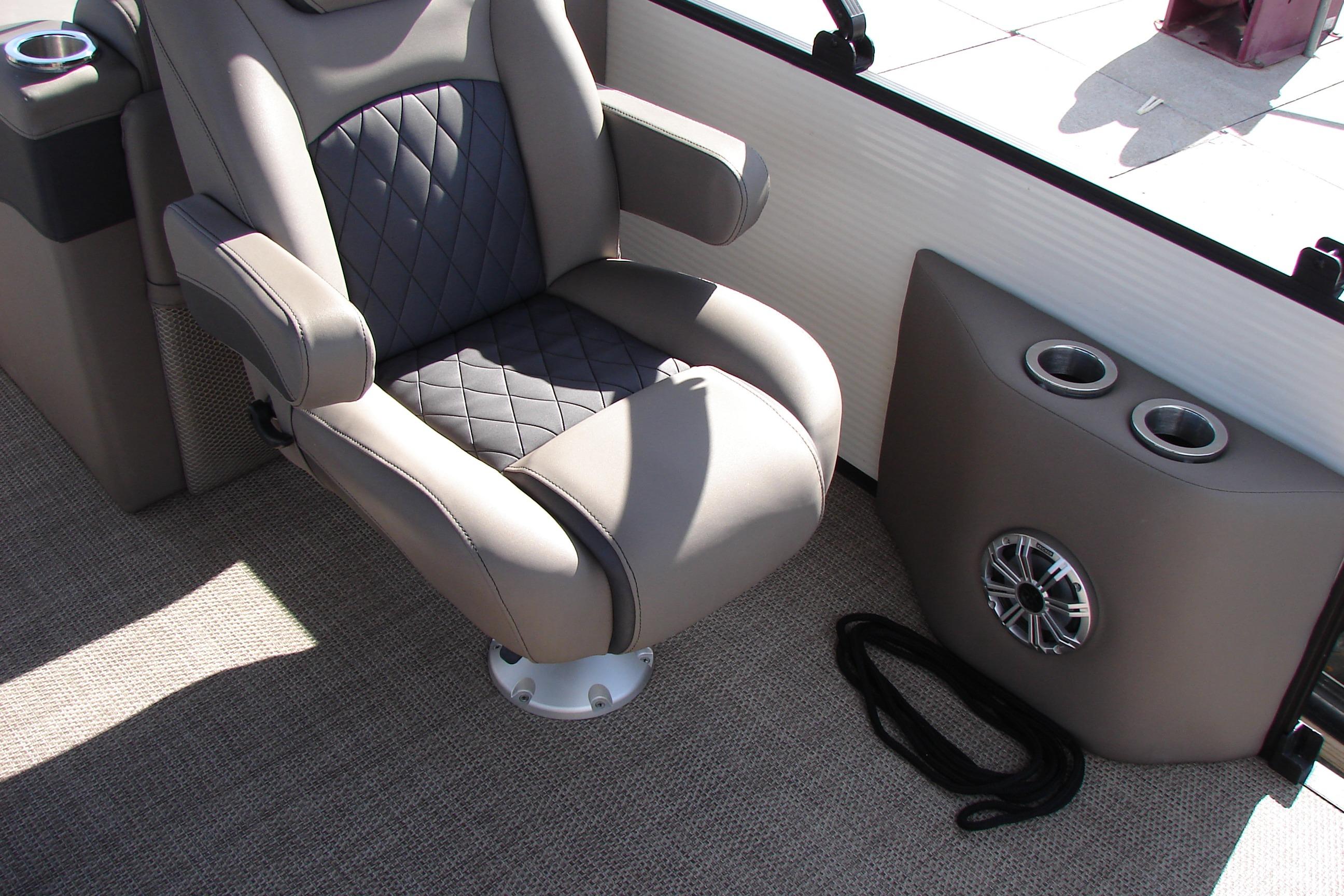 Luxurious seating on 2019 Bennington SX 25 SCWXP boat with cup holders and speaker.