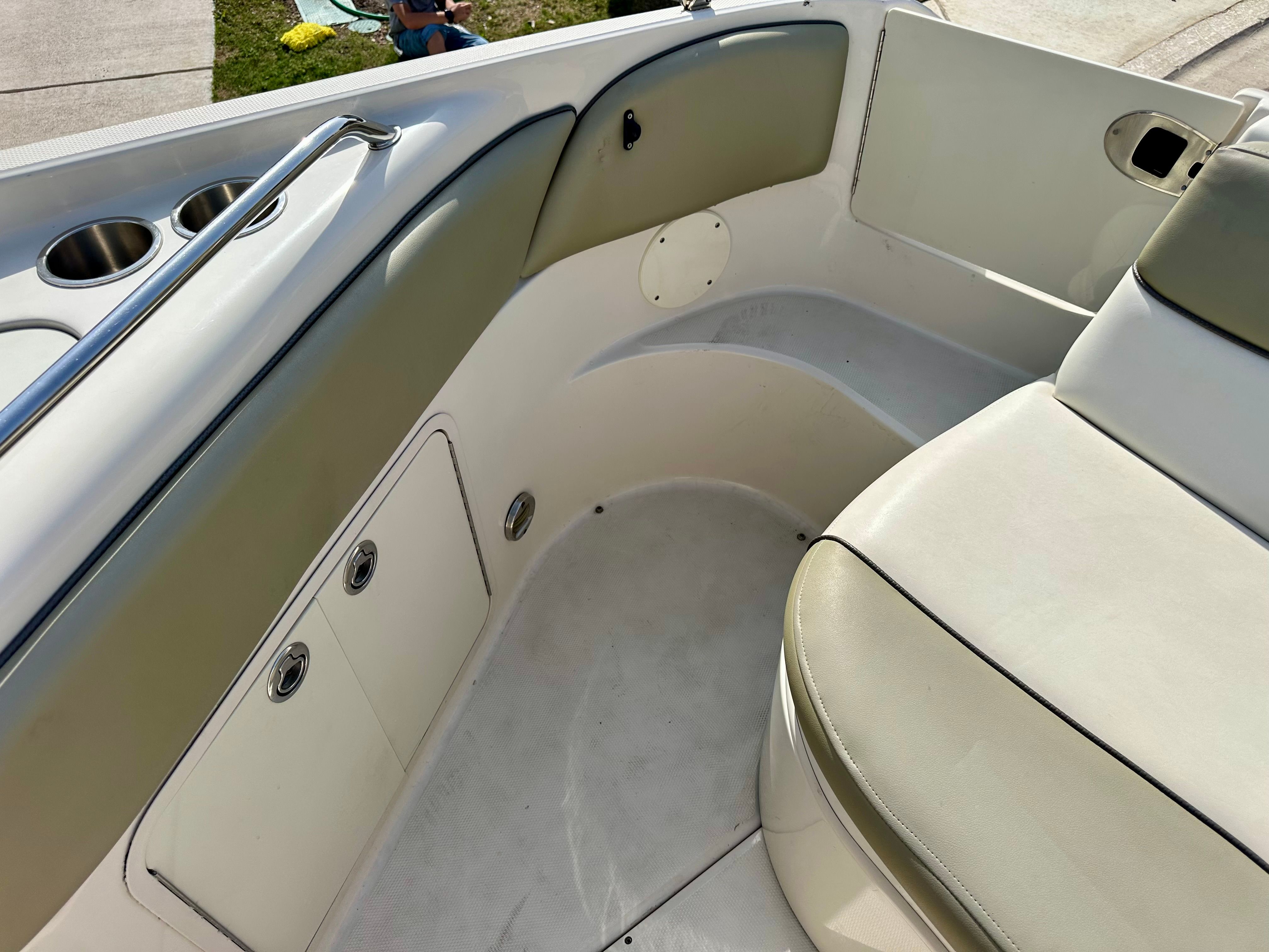 Interior of a 2006 Sea Ray 240 Sundeck boat with seating area.