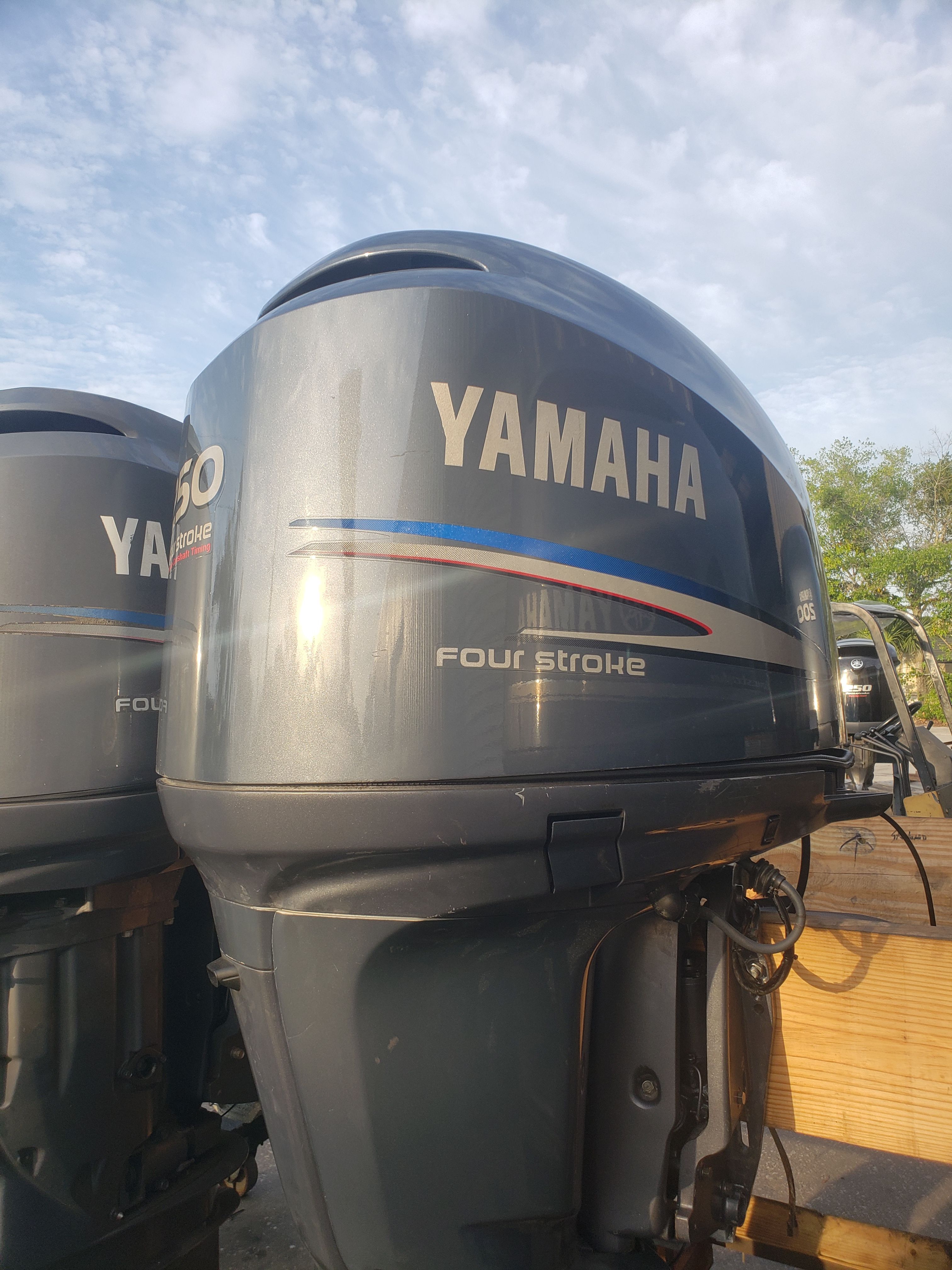 A Yamaha four-stroke outboard motor is mounted on a boat.