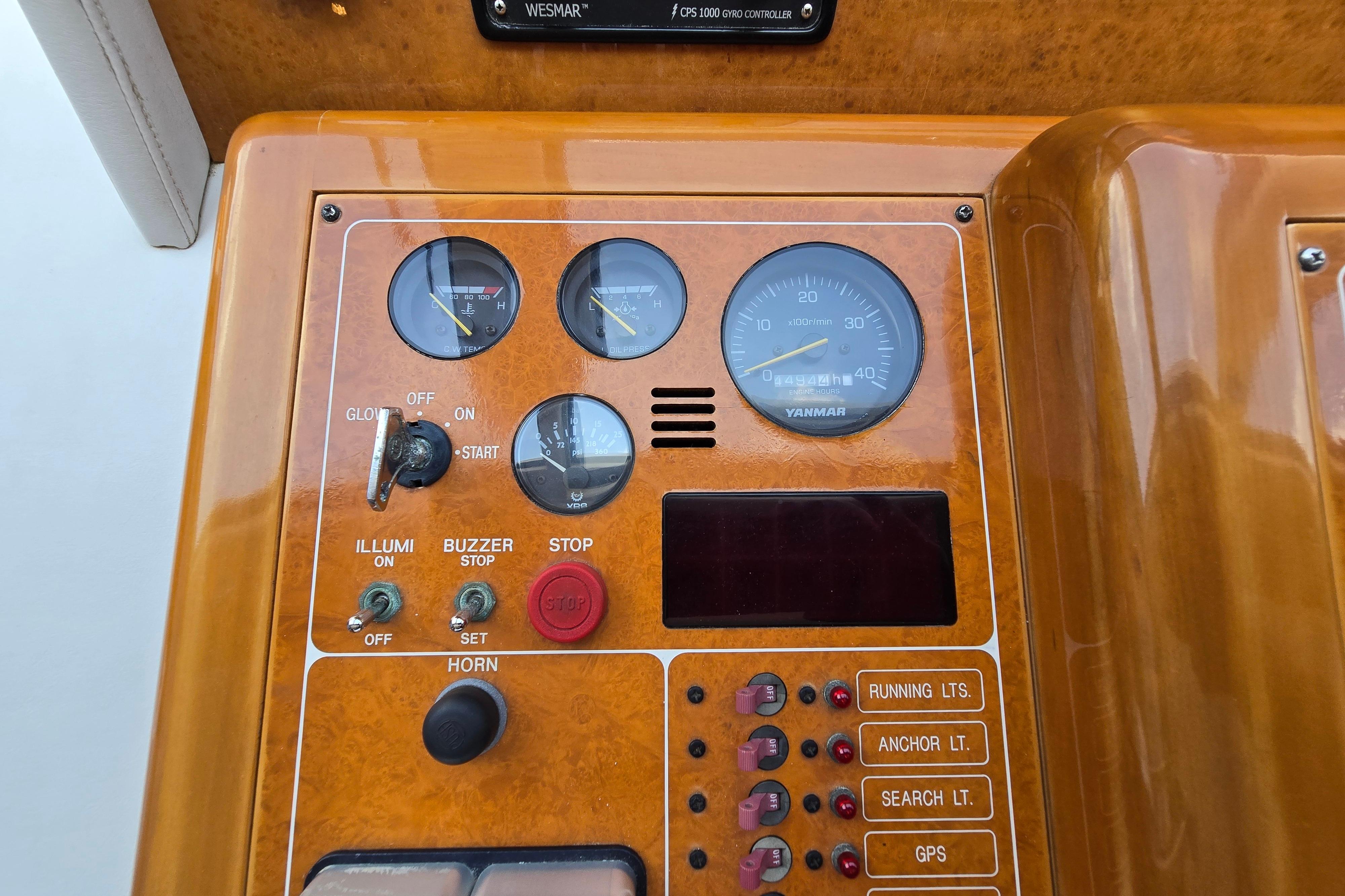 Control panel of a 2004 Grand Harbour 58 yacht with gauges and switches.