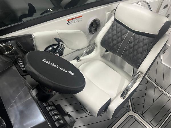 2024 Monterey M4 boat interior with luxury seating and modern steering wheel.