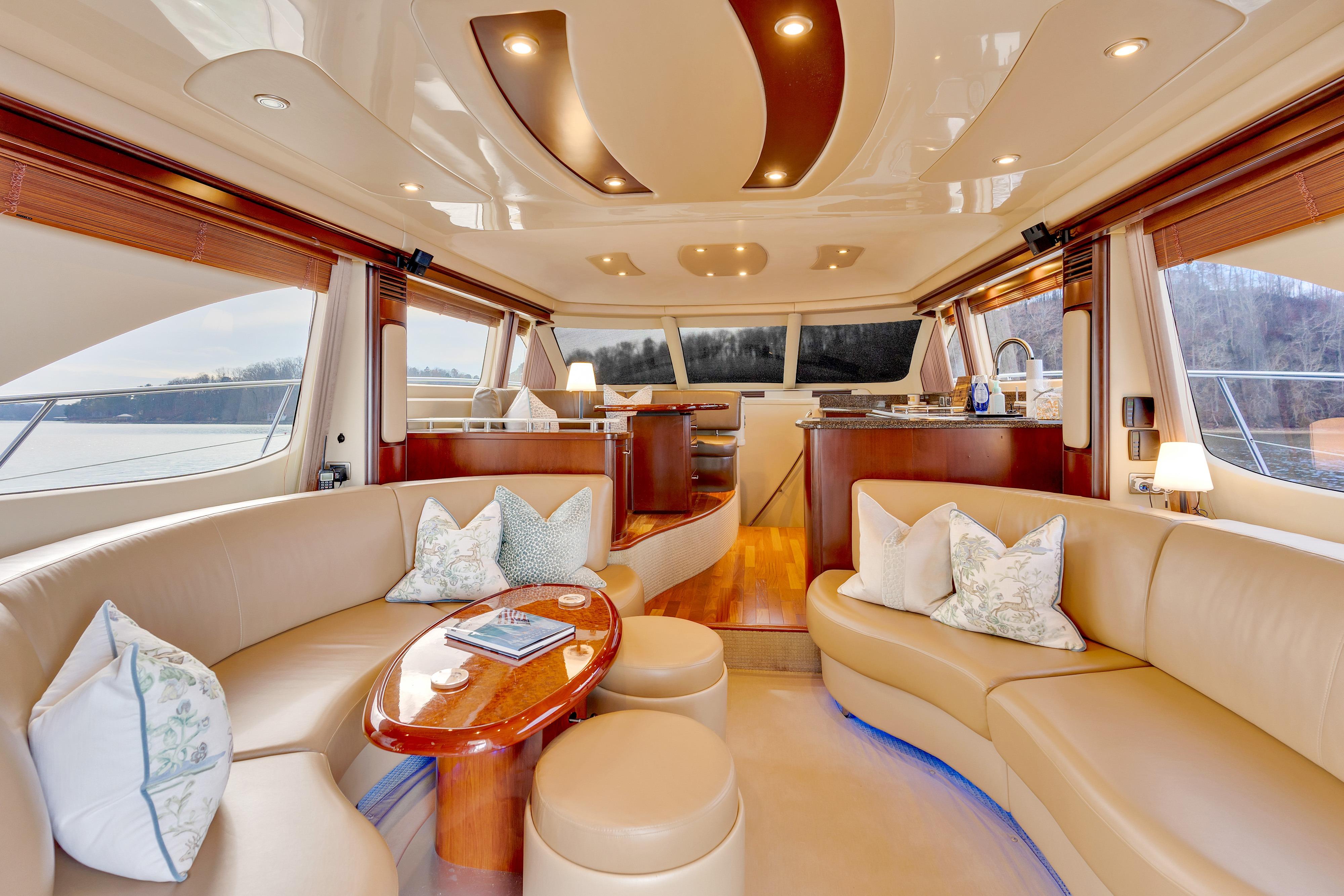 Luxurious interior of 2006 Sea Ray 58 Sedan Bridge yacht with elegant seating and decor.