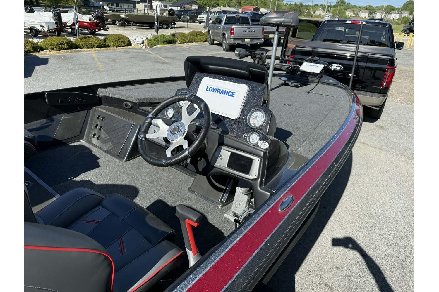 2023 Nitro Z20 Pro boat interior with steering wheel and Lowrance navigation system.