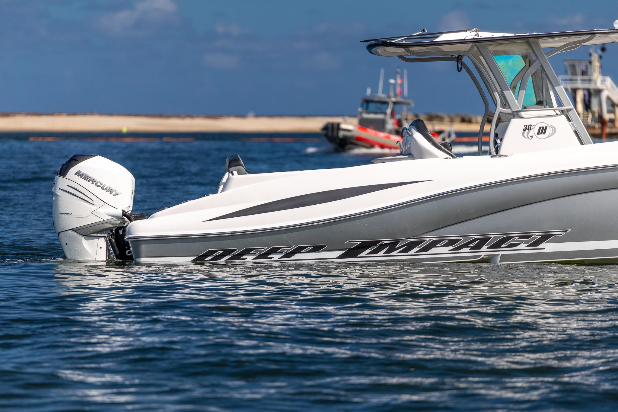2019 Deep Impact 369 Sport boat on water, featuring Mercury outboard engine.