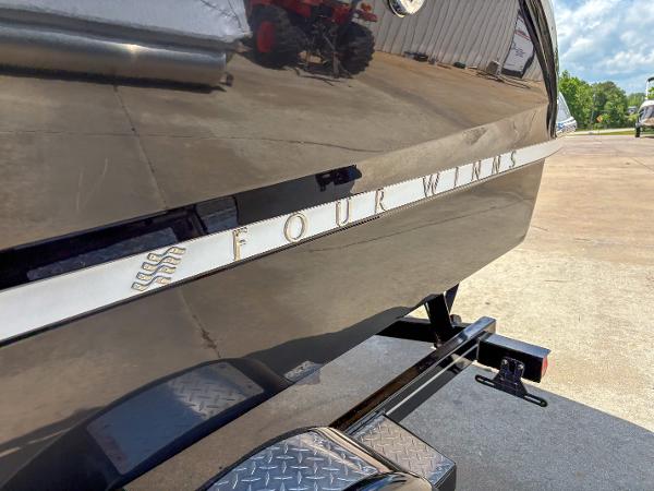 2023 Four Winns H1 boat on trailer, close-up of sleek hull design.