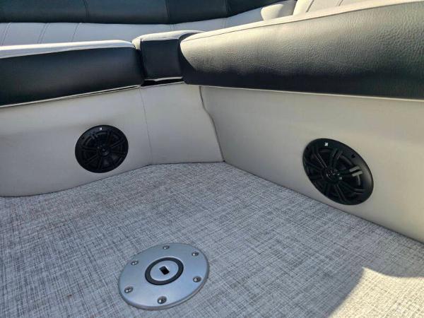 2025 Berkshire 20 CL boat interior with speakers and textured flooring.