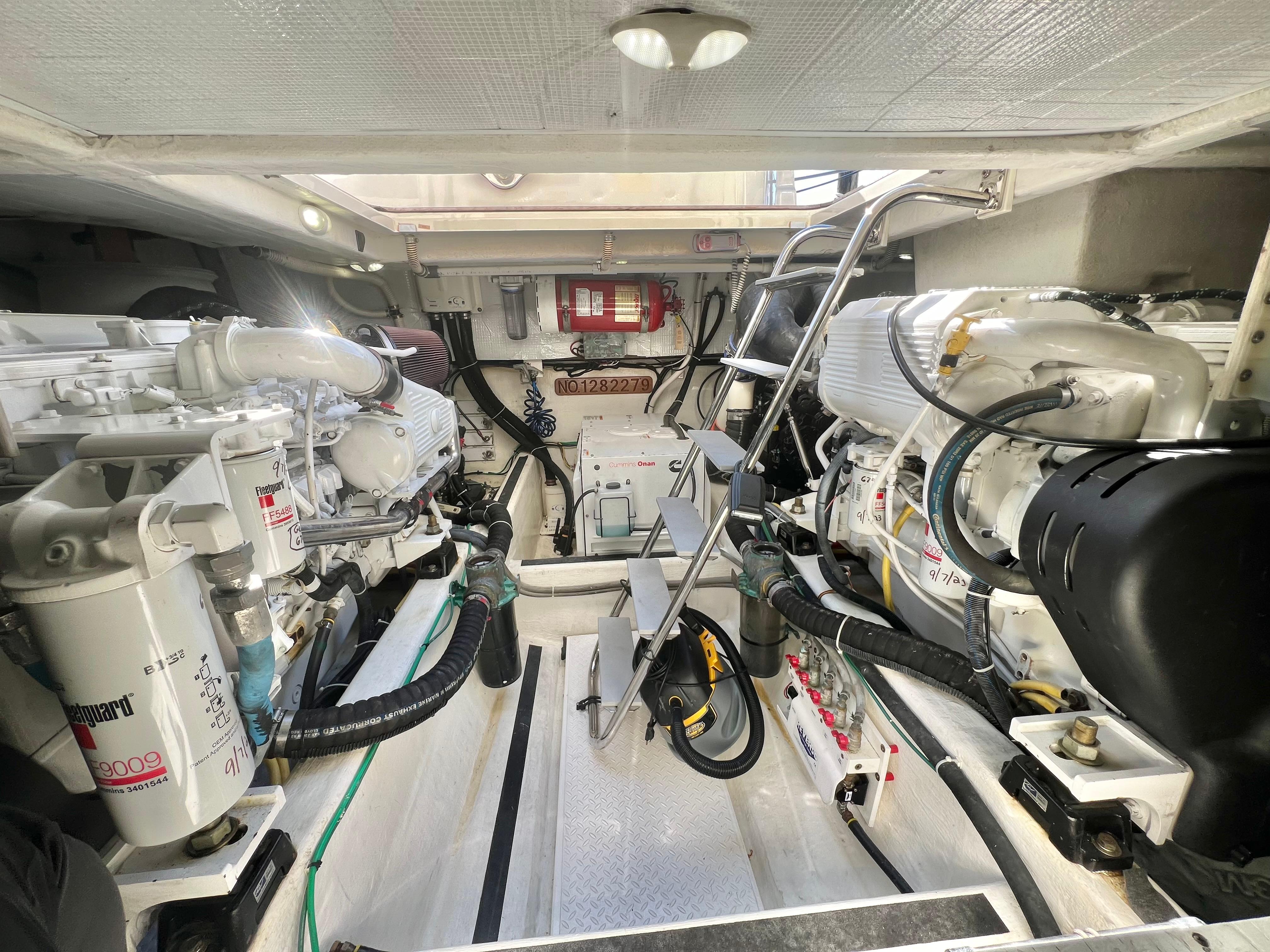 Engine room of 2017 Sabre 48 Salon Express, showcasing dual engines and mechanical components.