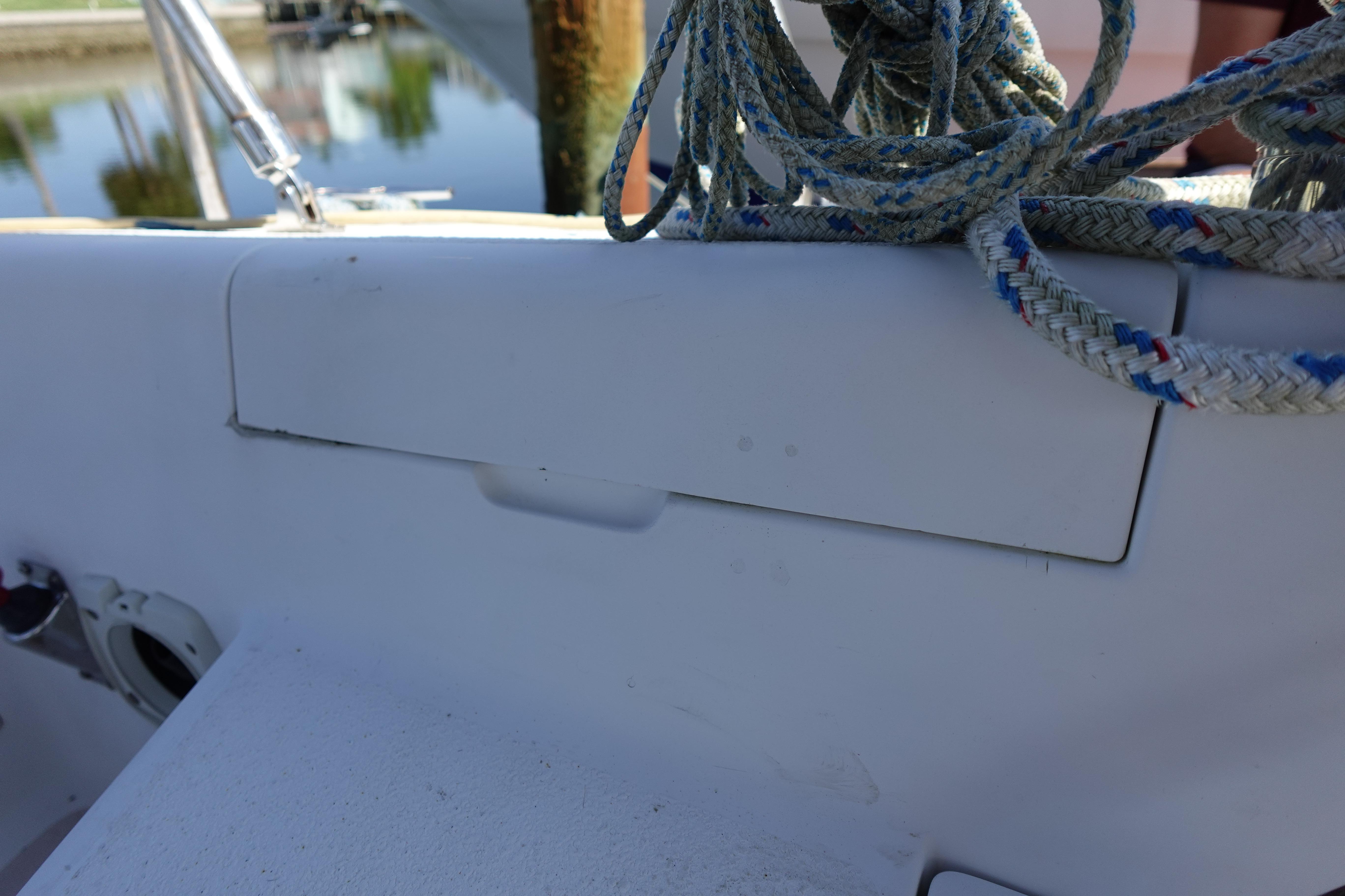 Close-up of a 1997 Catalina 28 sailboat deck with coiled ropes.