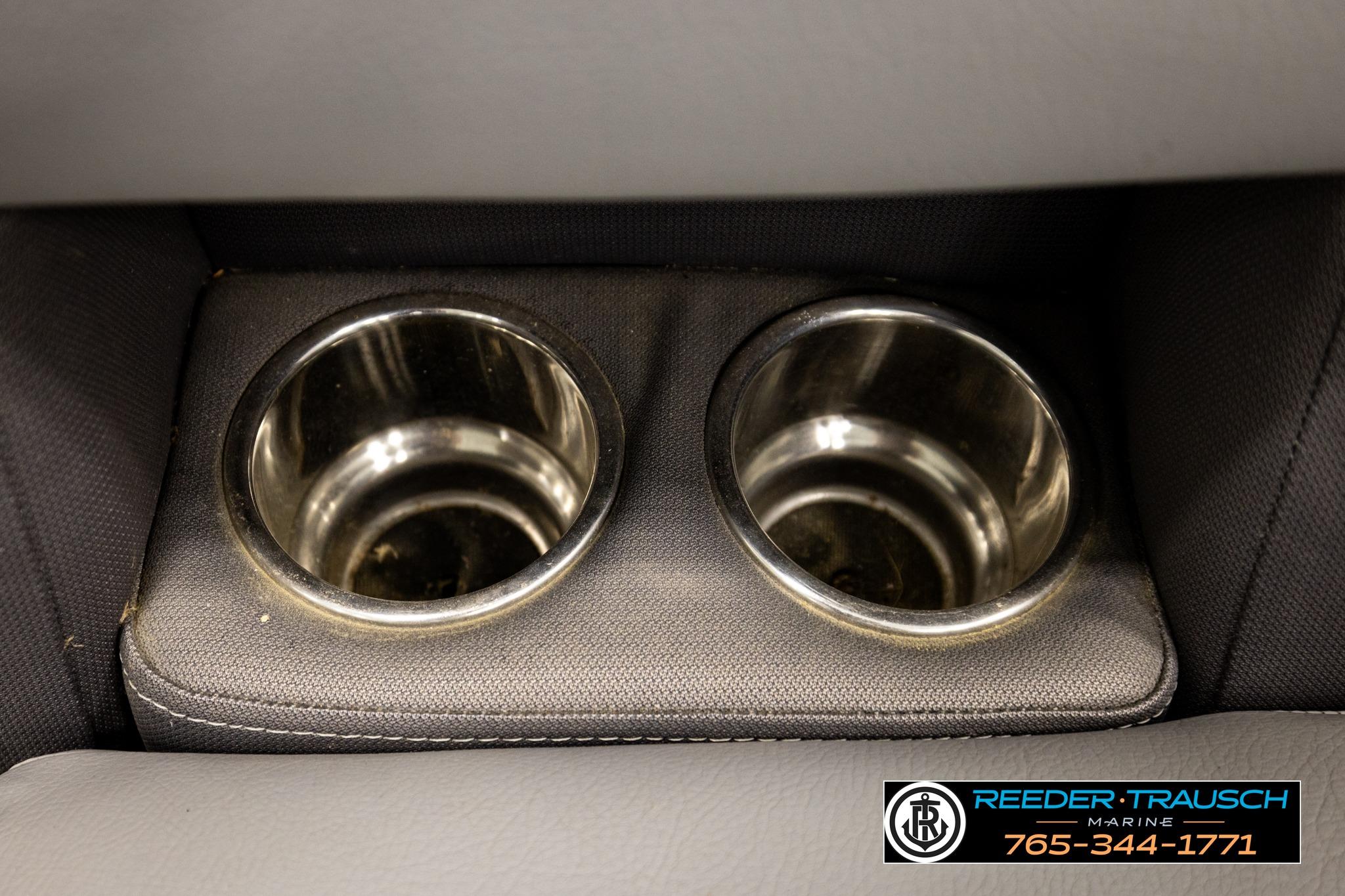 Cup holders in 2019 Manitou Oasis SR VP boat interior, Reeder Trausch Marine branding.