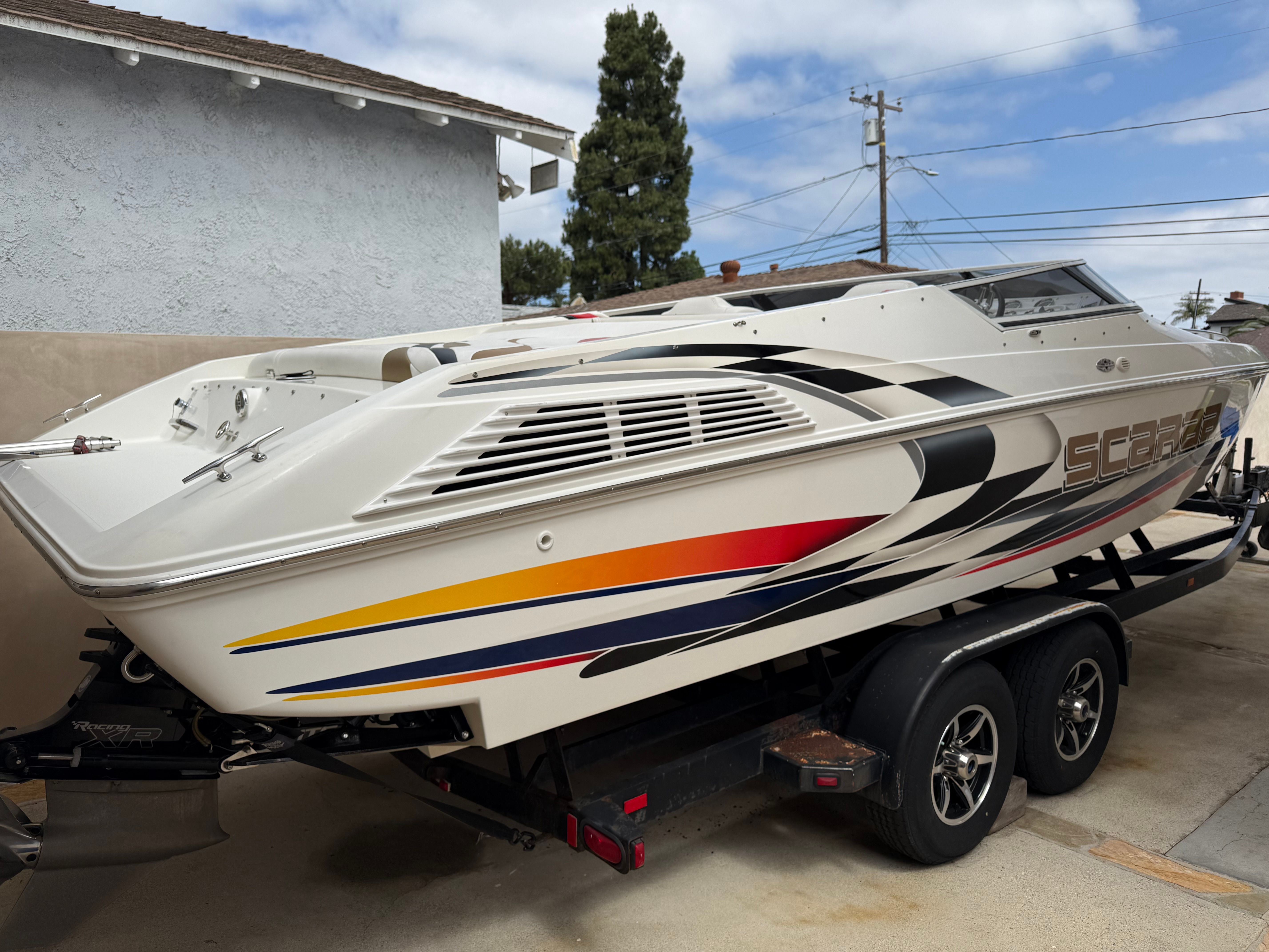 2001 Wellcraft 29 Scarab on trailer, side view.