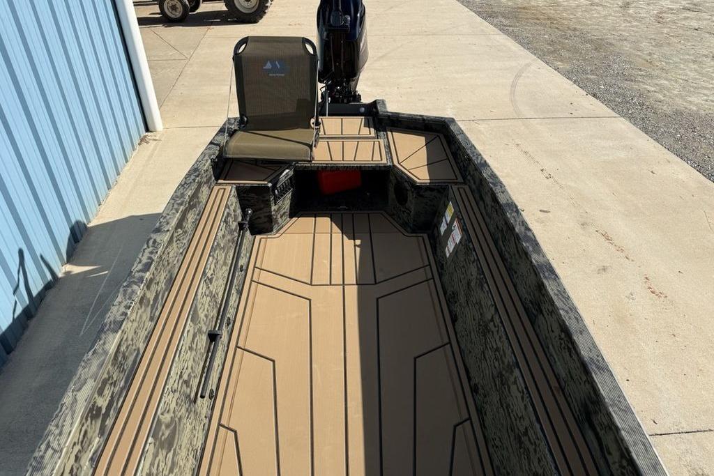 2026 Tracker Grizzly 1650 T Prairie Wings Edition boat with camo design and spacious interior.