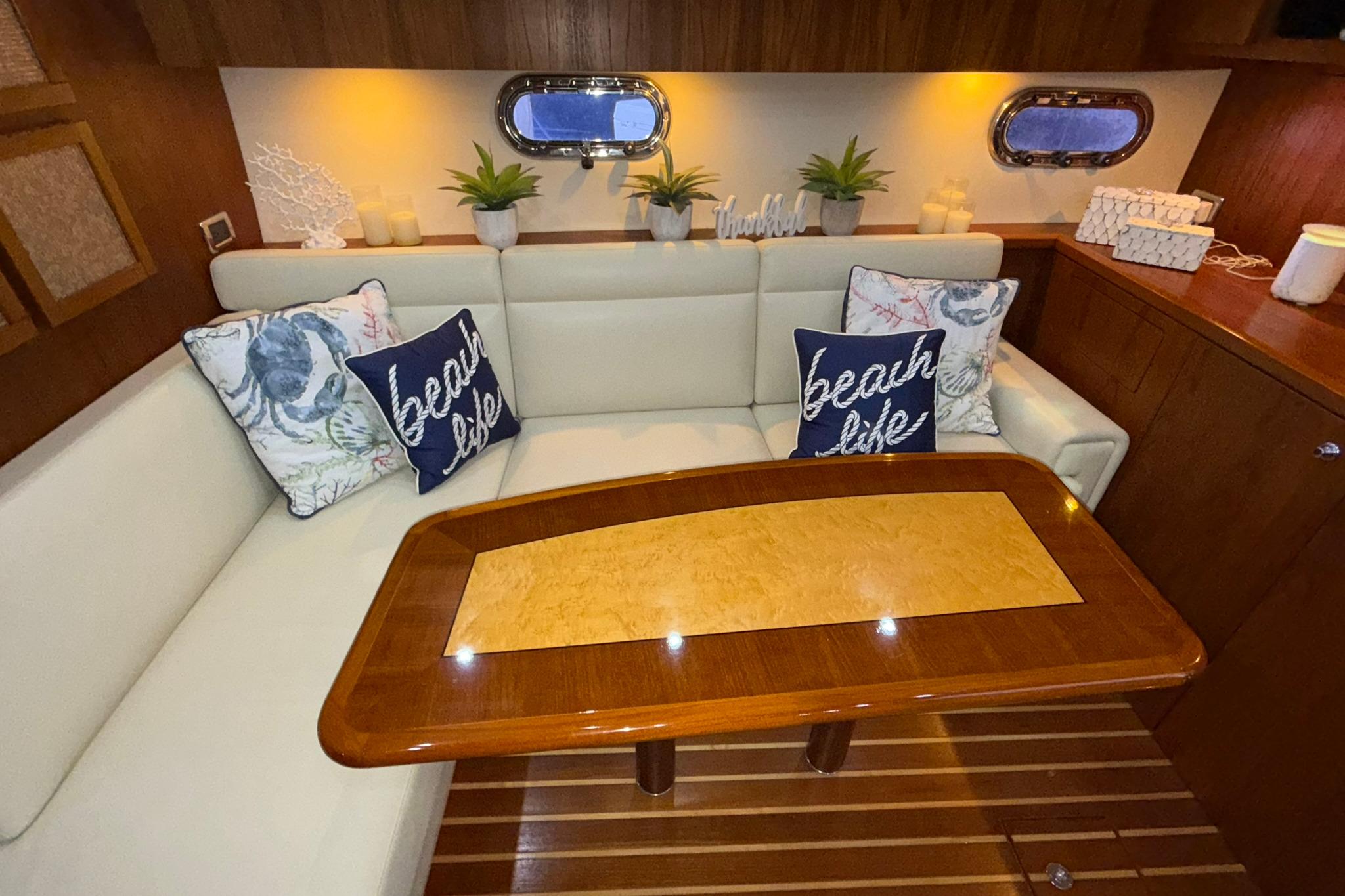 Luxurious 2011 Tiara Yachts 4500 Sovran interior with cozy seating and nautical decor.