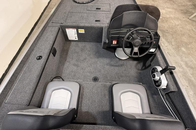 2026 Lowe Skorpion 16 boat interior with steering wheel and dual seats.