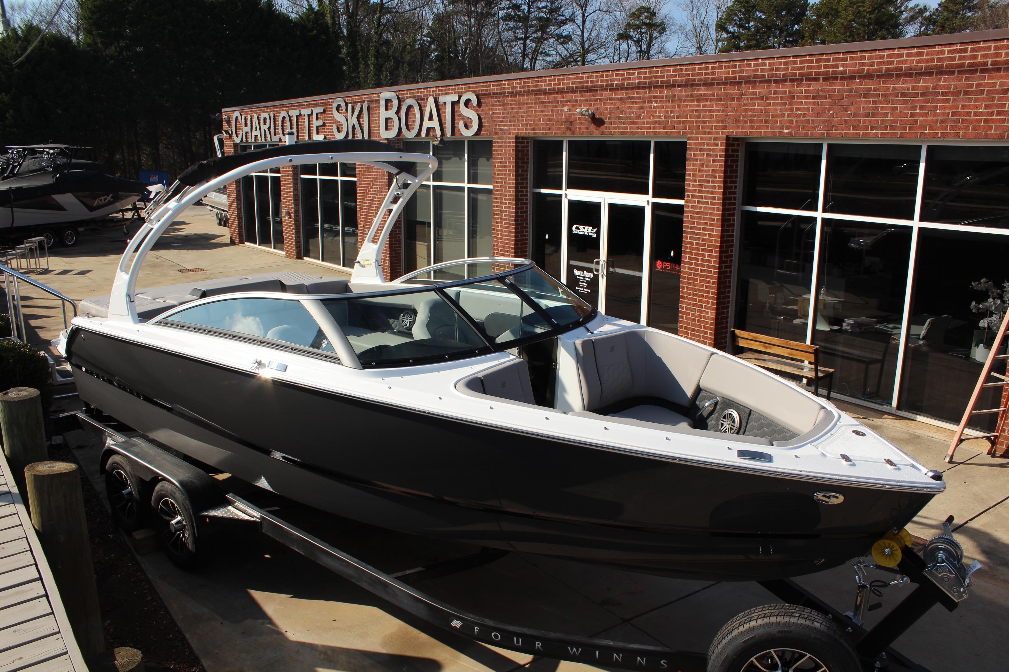 2026 Four Winns H4 boat on trailer at Charlotte Ski Boats dealership.