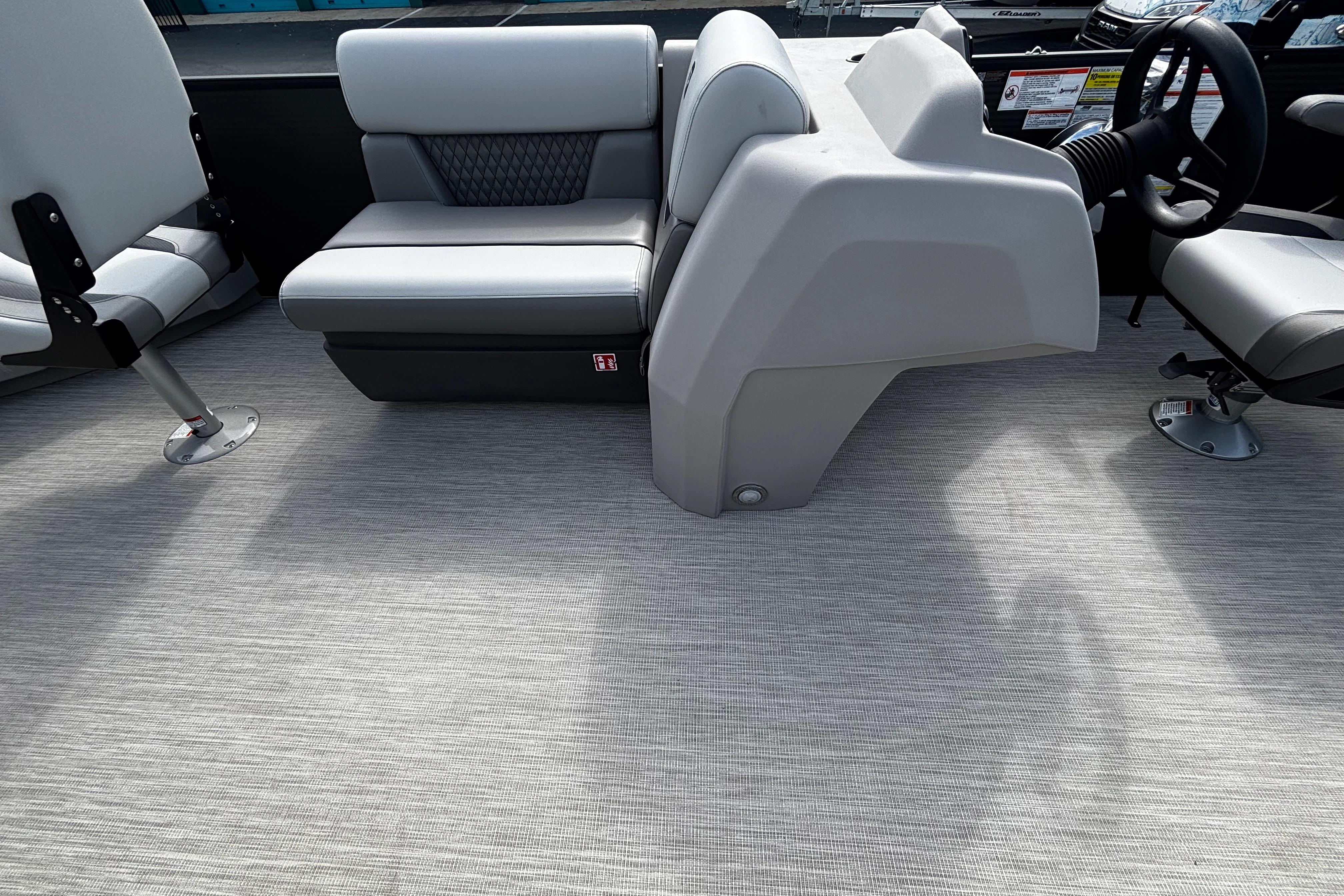 Interior of 2026 Princecraft Sportfisher 21-2S boat with modern seating and steering console.