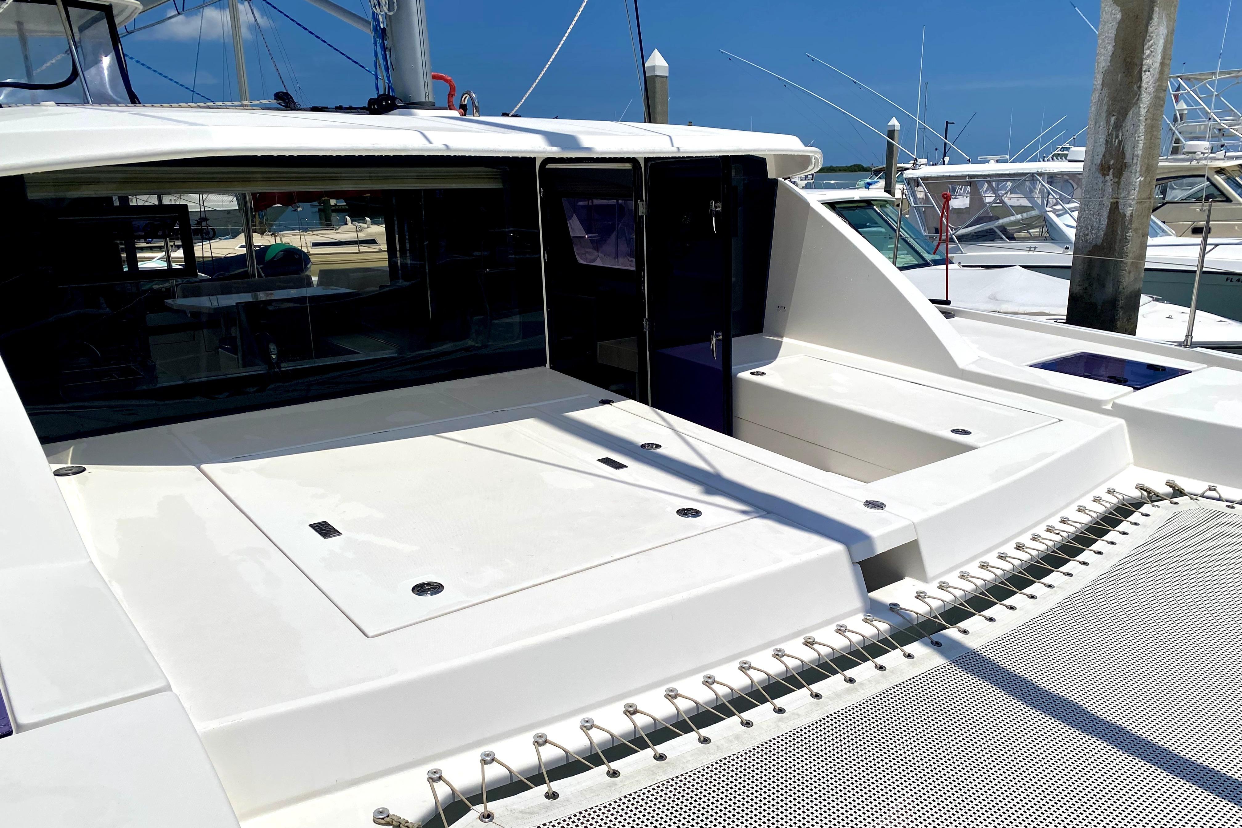 2017 Leopard 40 catamaran deck with sleek design and spacious layout at marina.