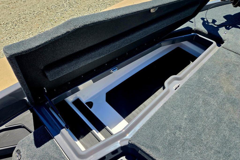 Open storage compartment in 2026 Skeeter ZXE20 boat, showcasing spacious interior design.