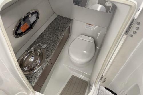 2026 Crownline Eclipse E255 boat bathroom with modern sink and toilet.