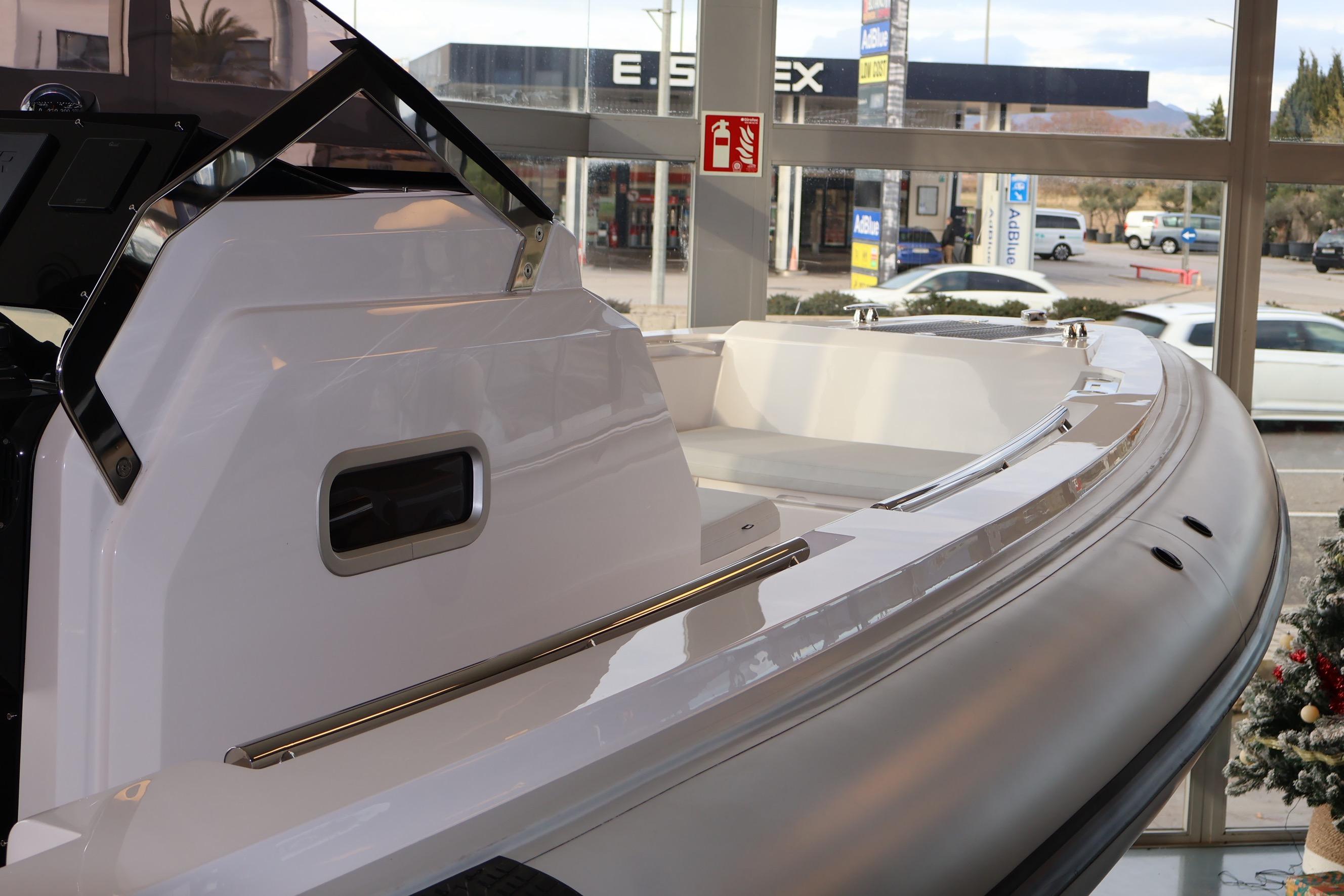 2026 Pirelli 30 boat displayed indoors, showcasing sleek design and modern features.