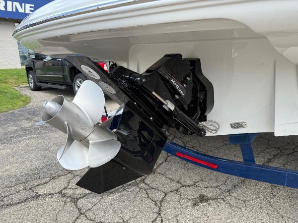 2025 Crownline 290 SS boat stern with propeller and outdrive on trailer.