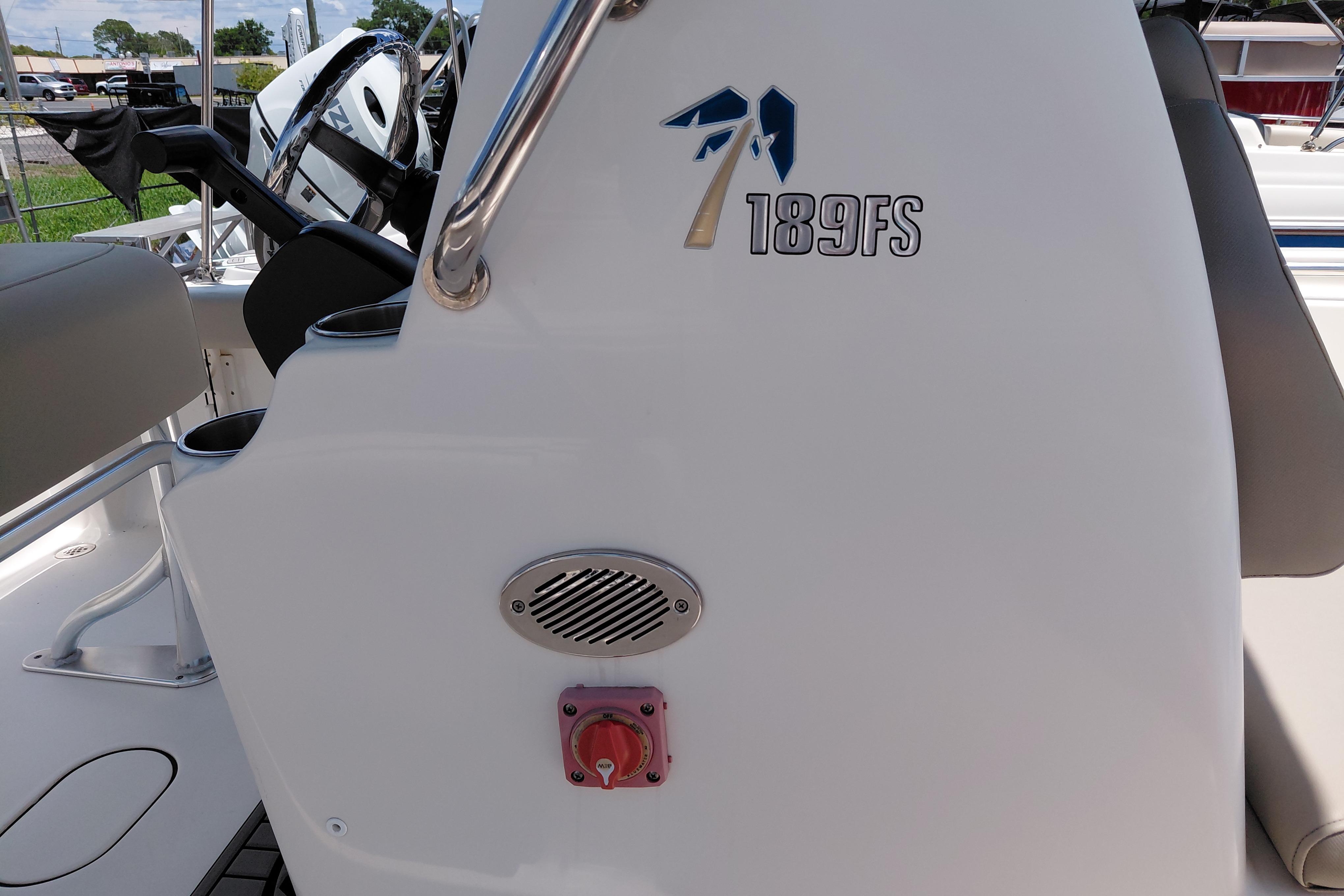 2023 Key West 189 FS boat interior with steering wheel and console details.