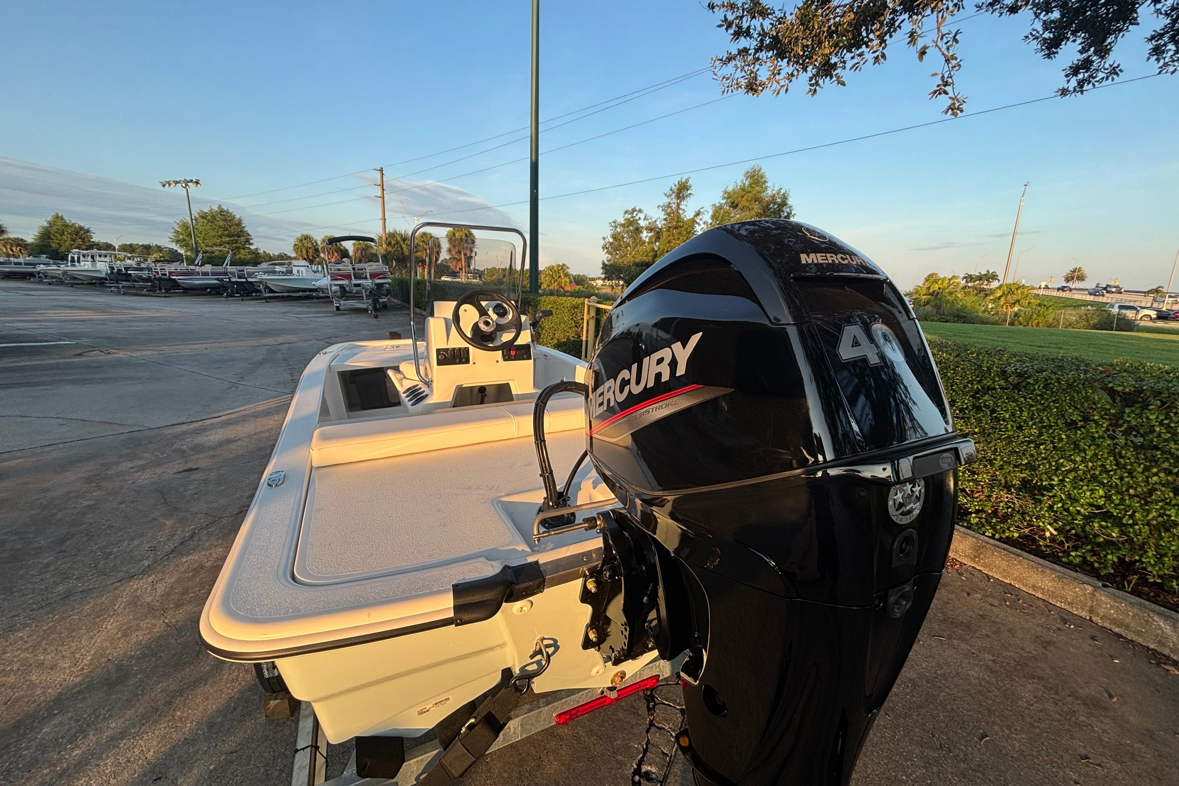 2026 Mako Pro Skiff 13 CC with Mercury 40 outboard engine in a parking lot.