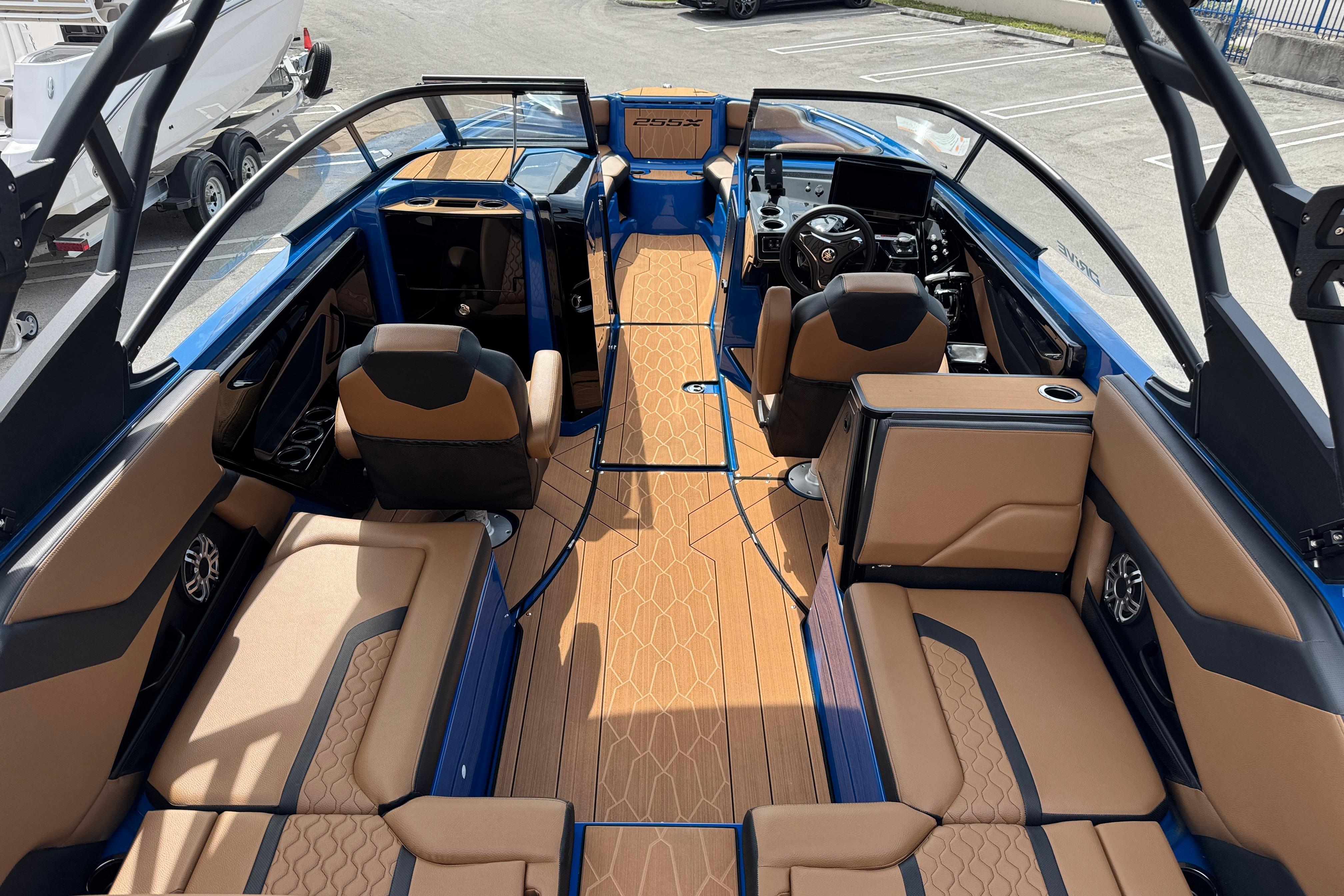 2026 Yamaha Boats 255XD interior with luxurious seating and modern dashboard design.