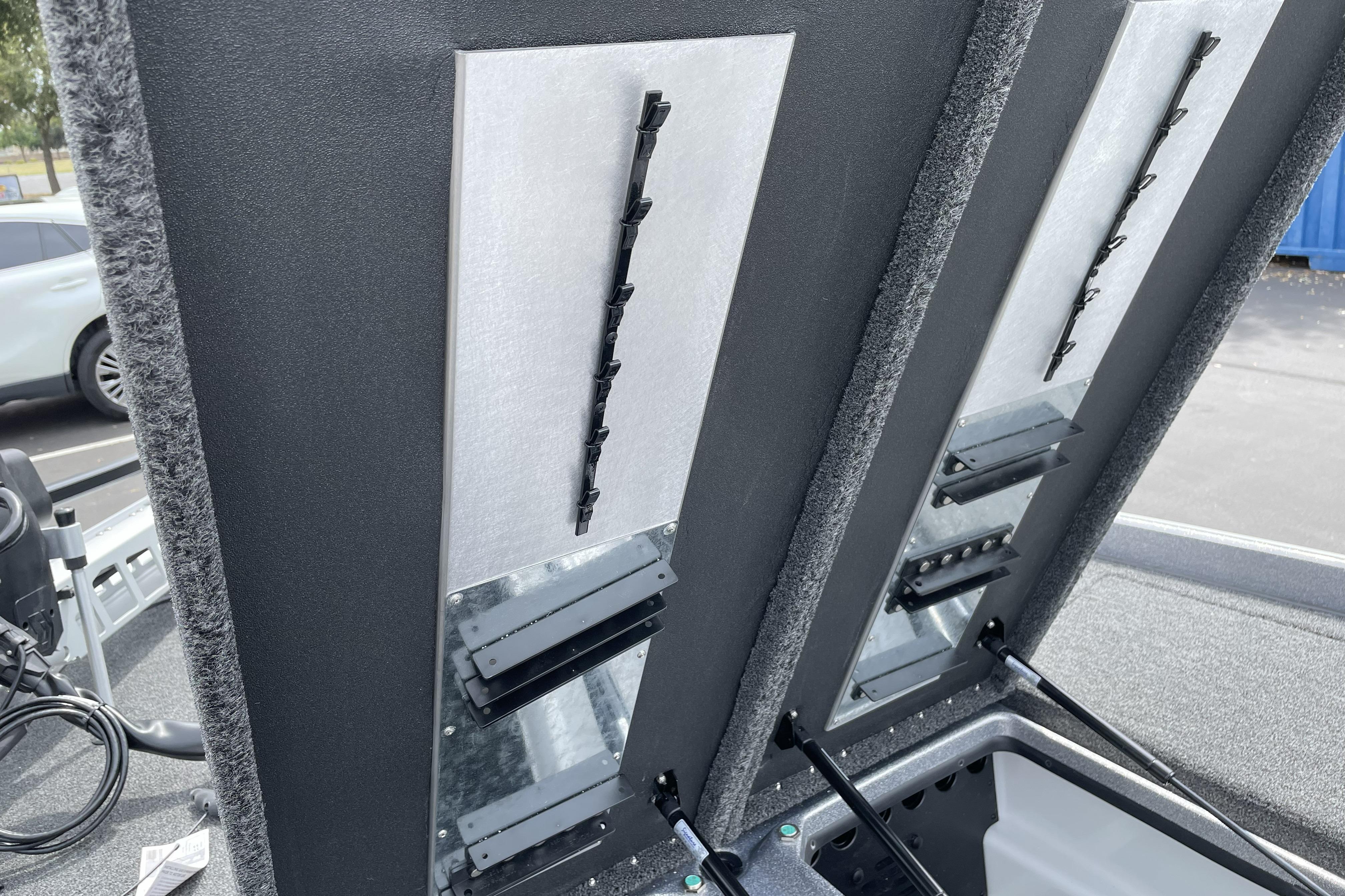 2026 Nitro Z21 XL boat storage compartments with organized rod holders.