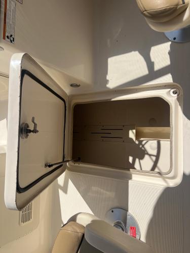 2019 Scout 210 Dorado storage compartment with open hatch.