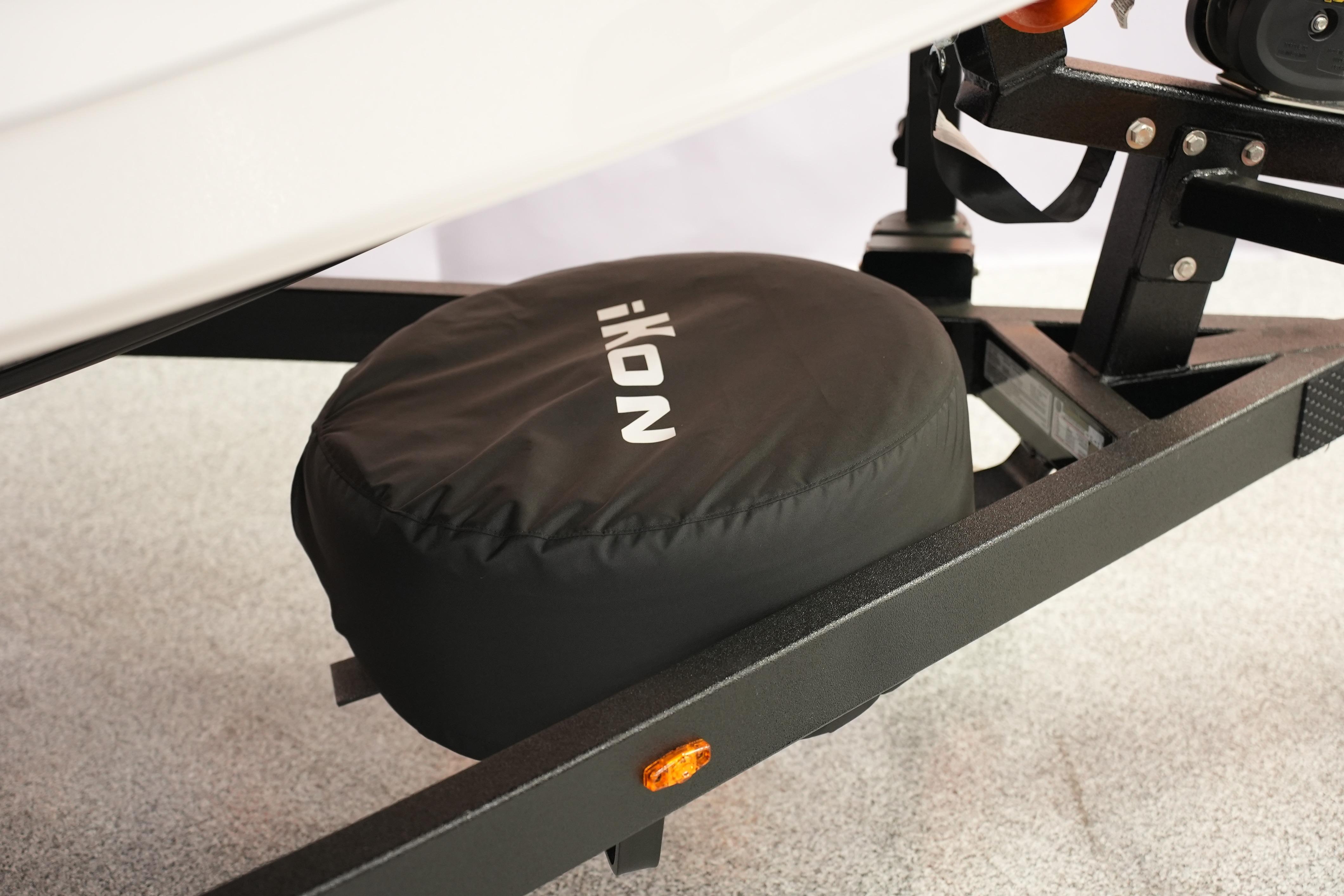 Trailer hitch with iKon VLE21 tire cover, 2026 model, on a textured surface.