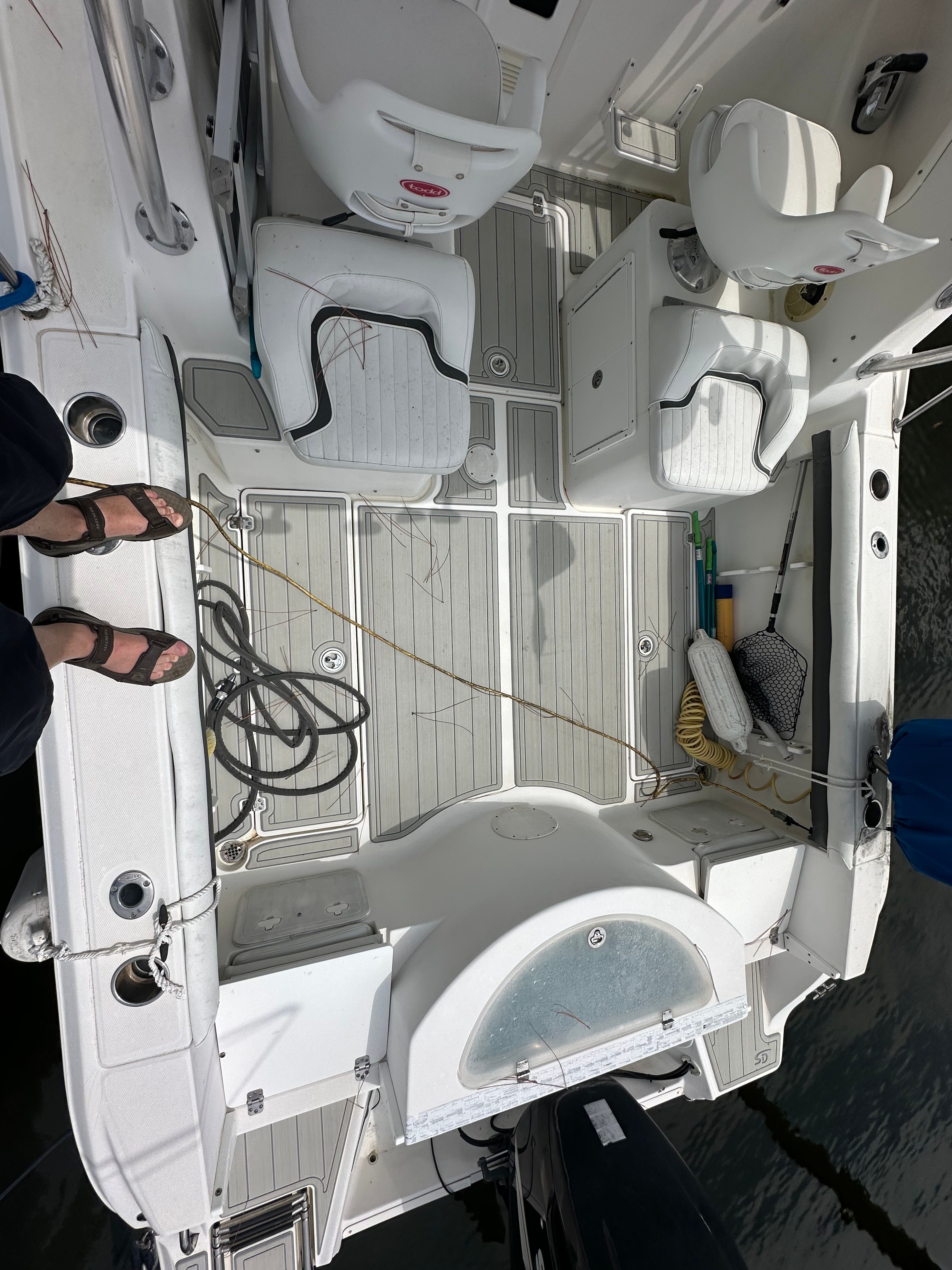 The image shows the cockpit of a 2009 Sea Fox 256WA boat with seating and equipment.