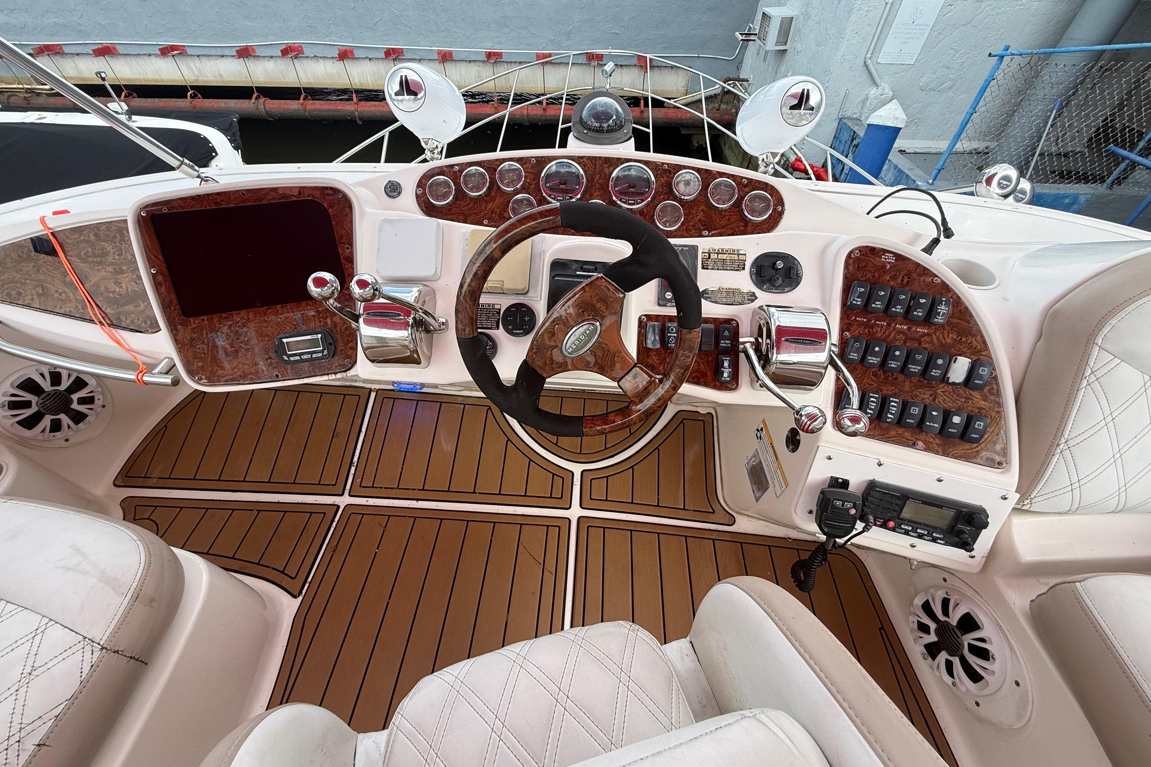 Cockpit of 2007 Meridian 459 Motoryacht with wood accents and modern controls.