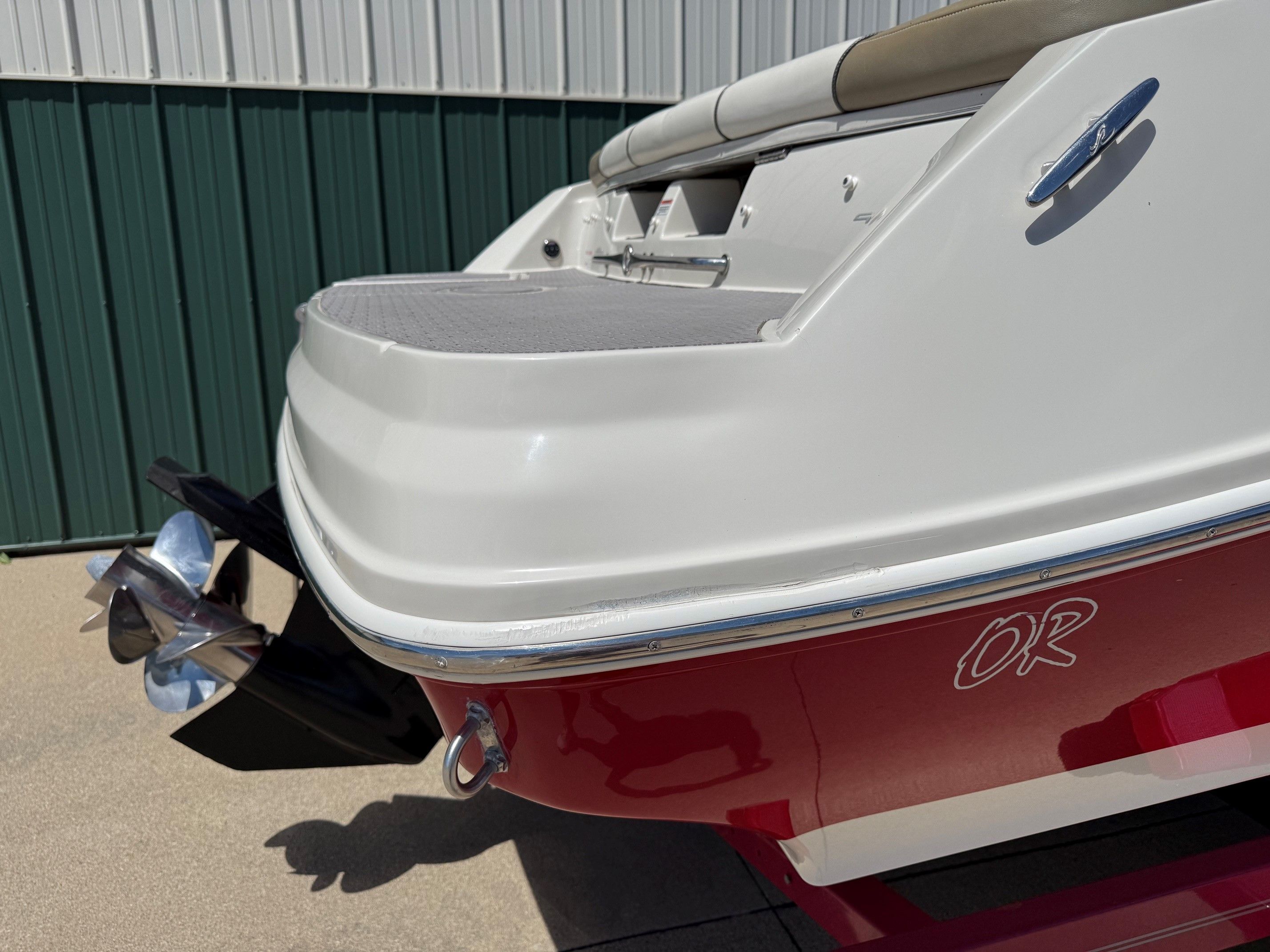 Red 2007 Sea Ray 230 Select boat at dock.