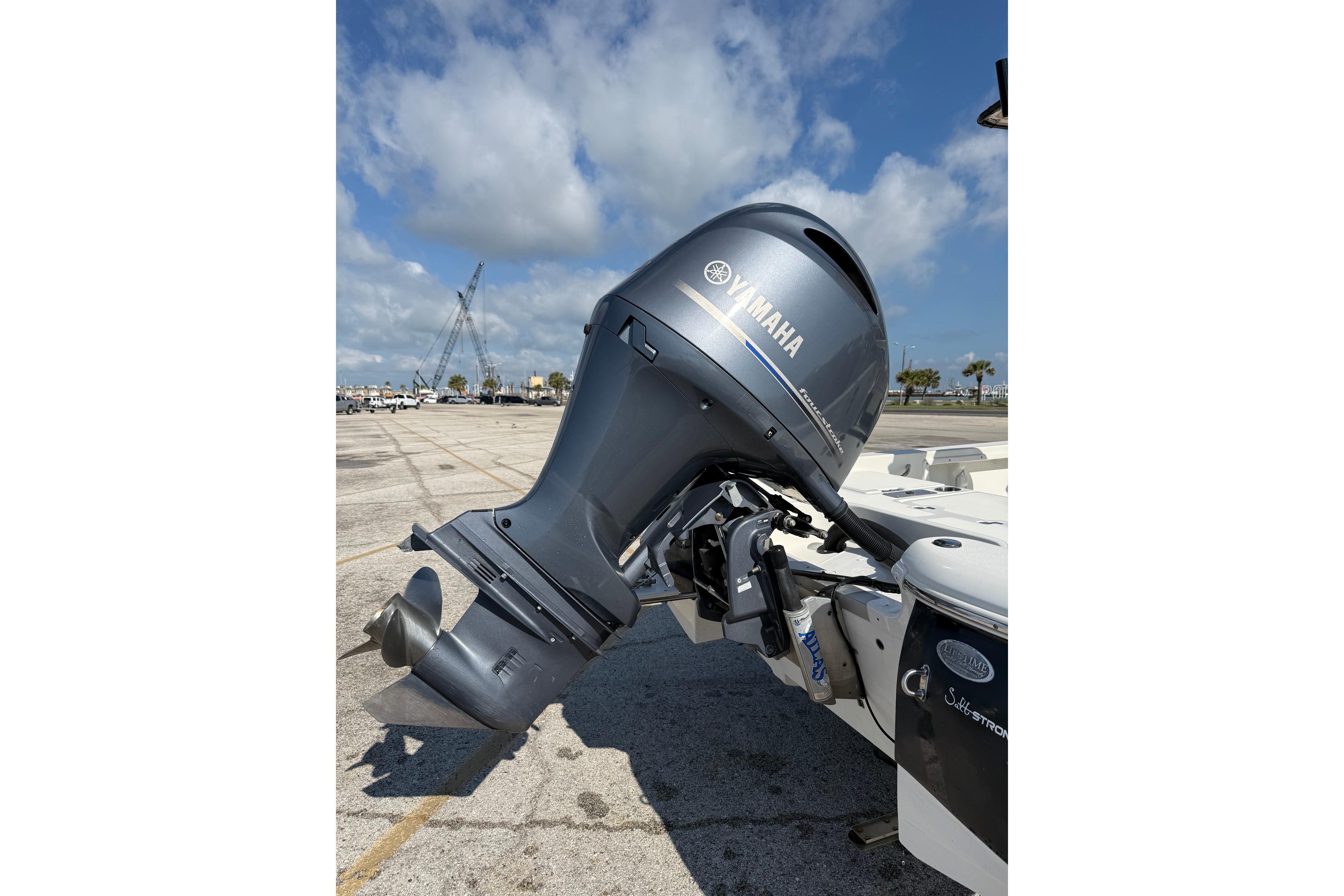 2015 NauticStar 224 XTS with Yamaha outboard motor in a parking lot.