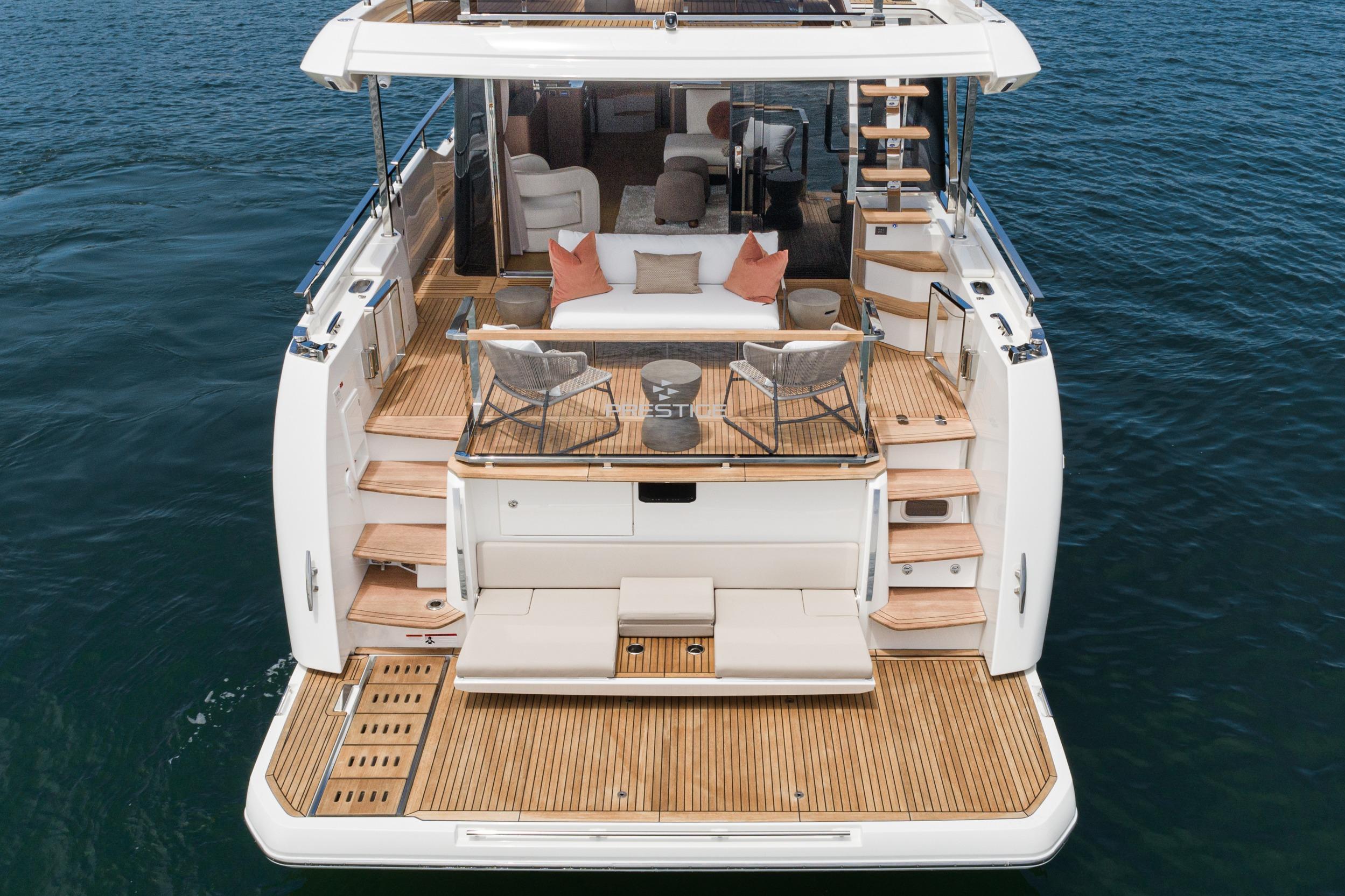Luxurious 2024 Prestige X60 yacht with elegant deck and seating area on the water.