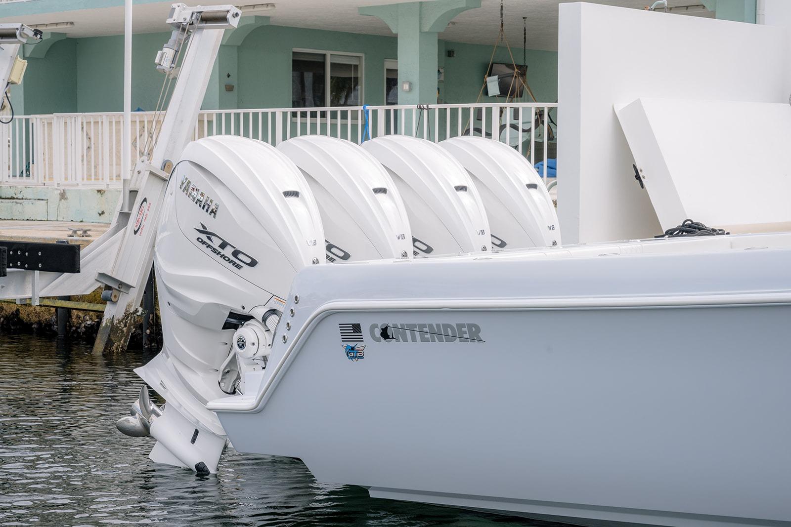 2024 Contender 44 ST boat with four Yamaha 425 XTO outboard engines docked.