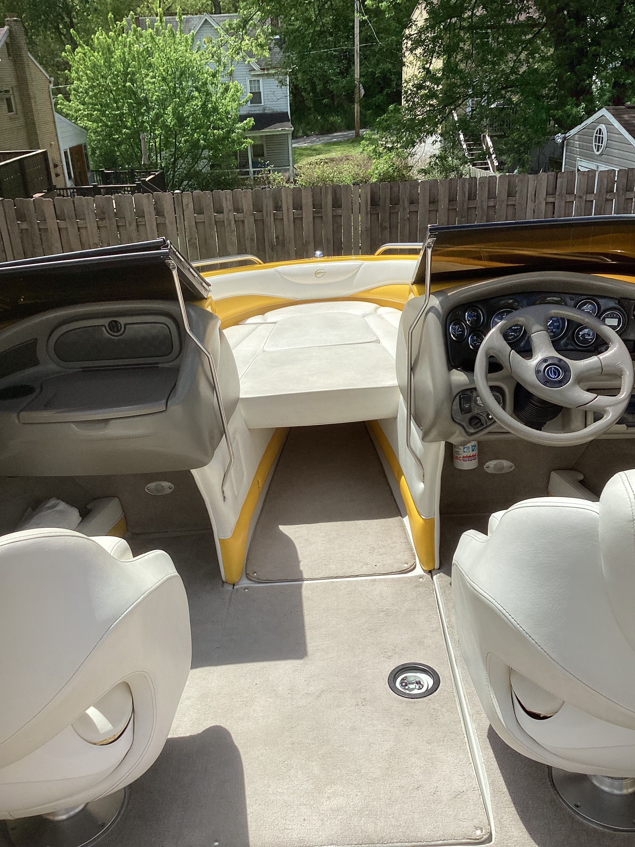 Interior of a 2005 Crownline 202 BR LPX boat with yellow accents.