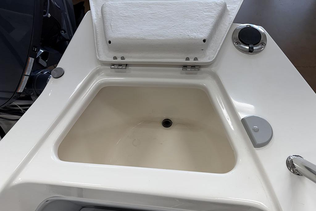 Open storage compartment on 2027 Arima Sea Ranger 21 Yellowtail Edition boat.