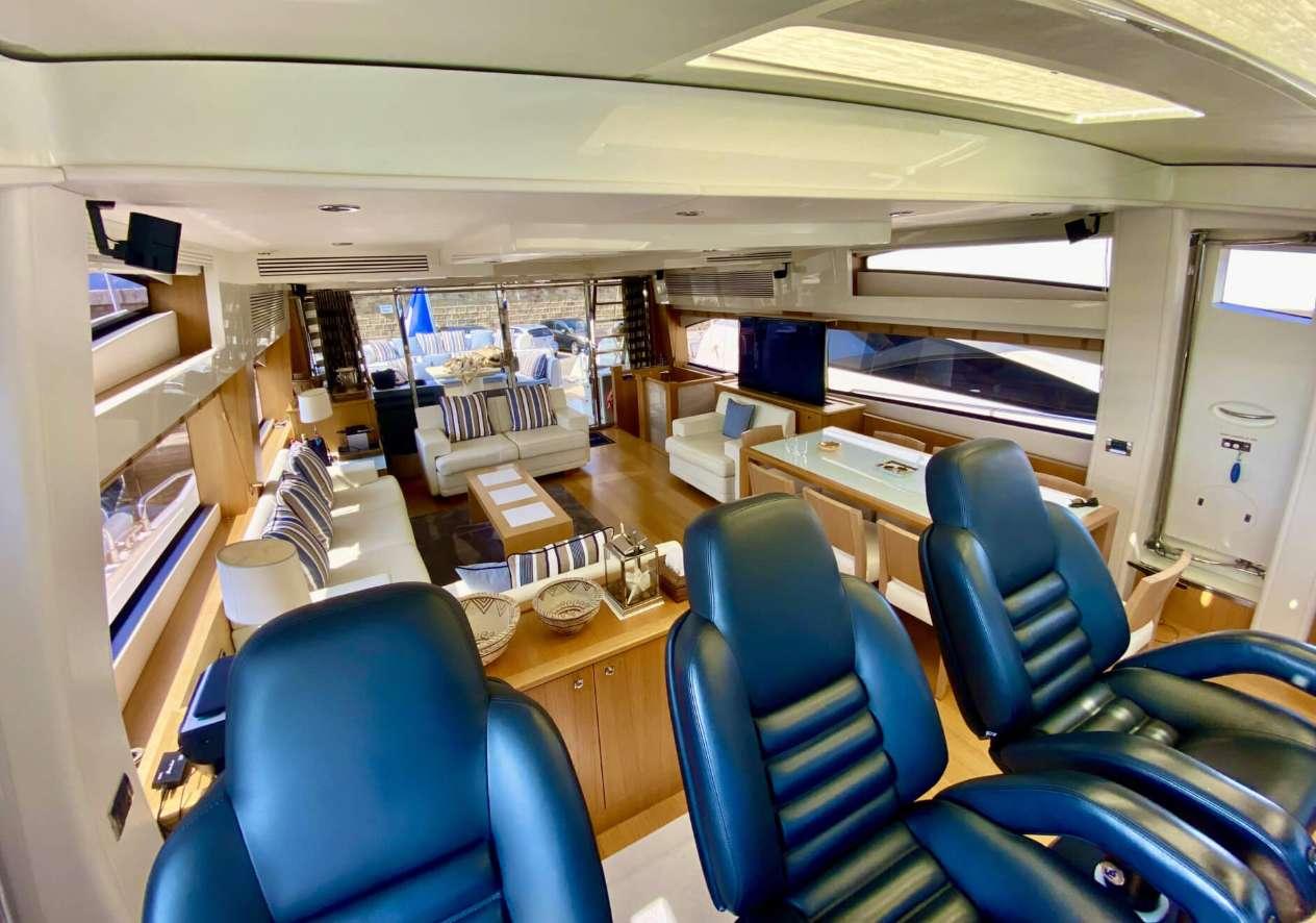 Luxurious interior of 2011 Sunseeker Predator 84 yacht with plush seating and modern design.