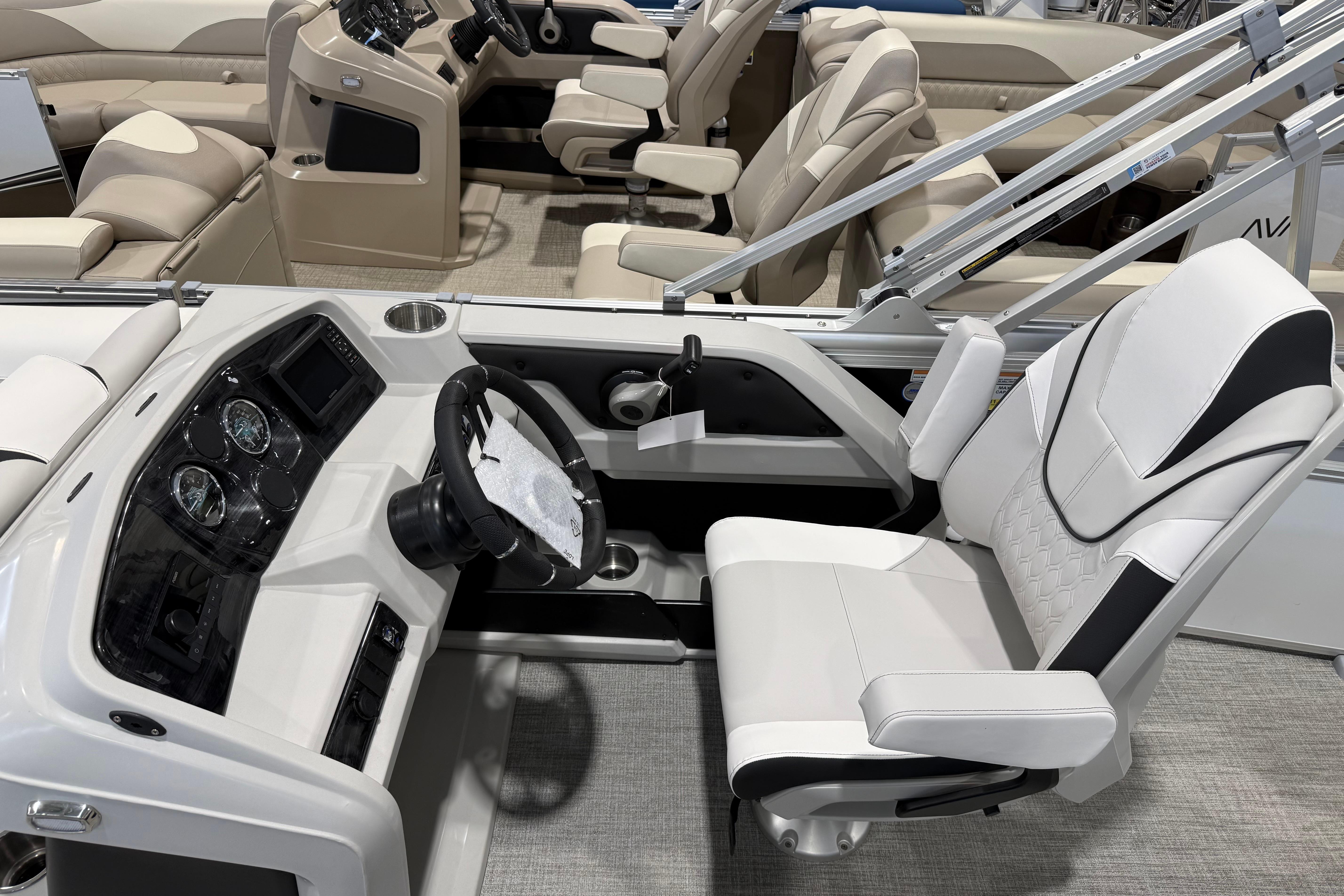 2026 Avalon 2385 25 LSZ VRB boat interior with modern helm and seating.