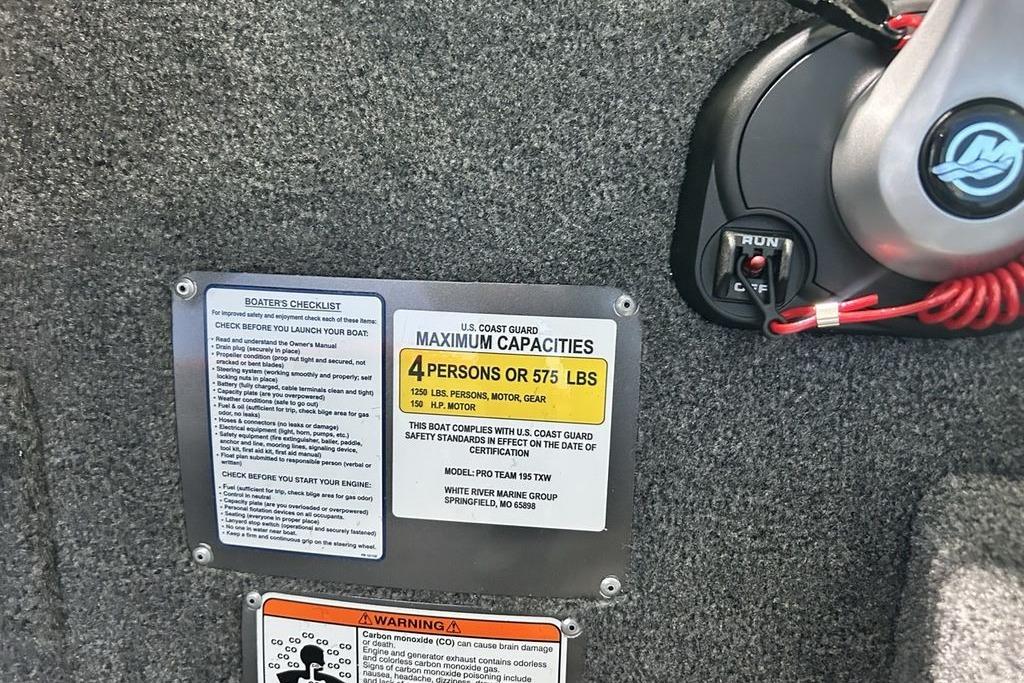 Boat capacity and safety labels on 2026 Tracker Pro Team 195, showing maximum load and engine details.