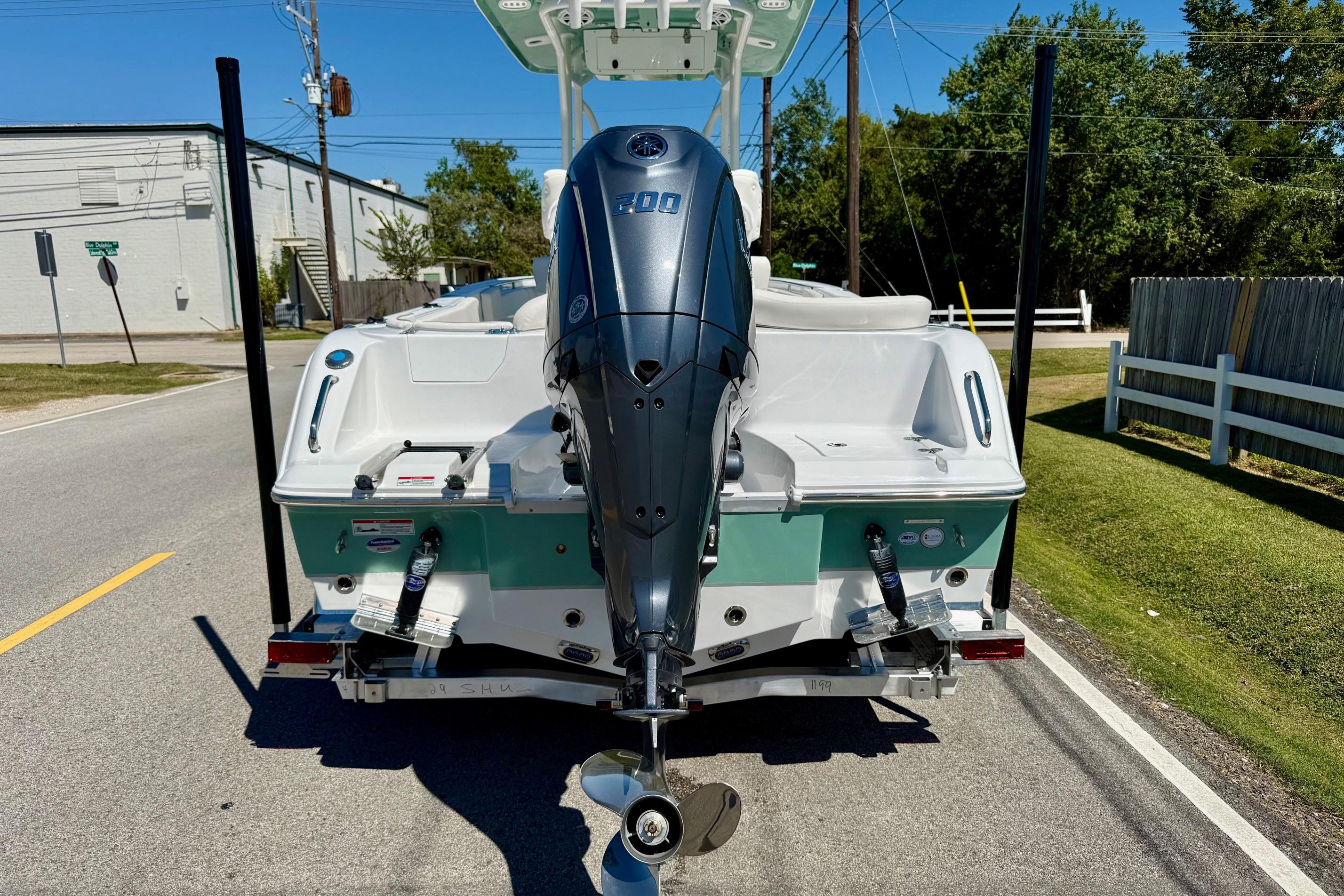 2026 Sea Hunt Ultra 229 boat with powerful outboard motor on a trailer.
