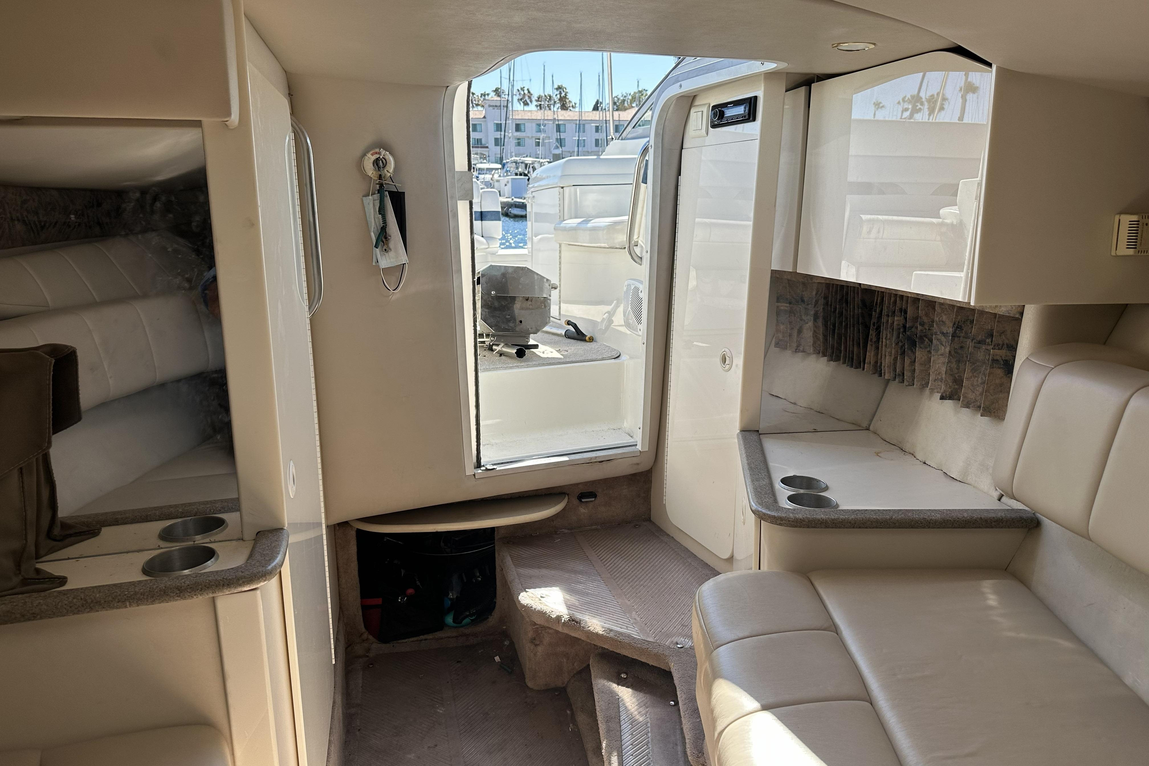 Interior of 2000 Formula 280 Sun Sport boat with seating and cabin view.