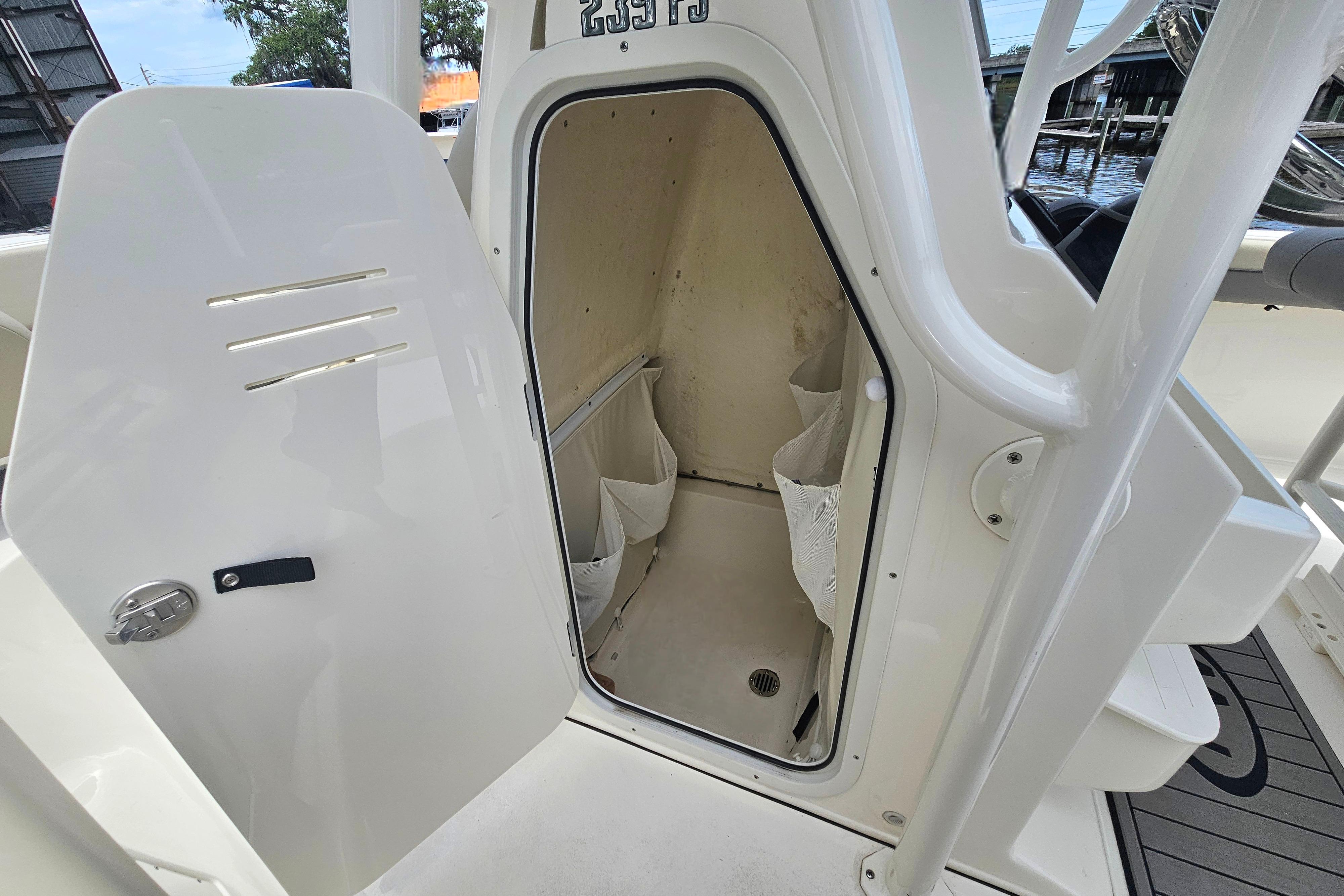 Open storage compartment on a 2025 Key West 239 FS boat.